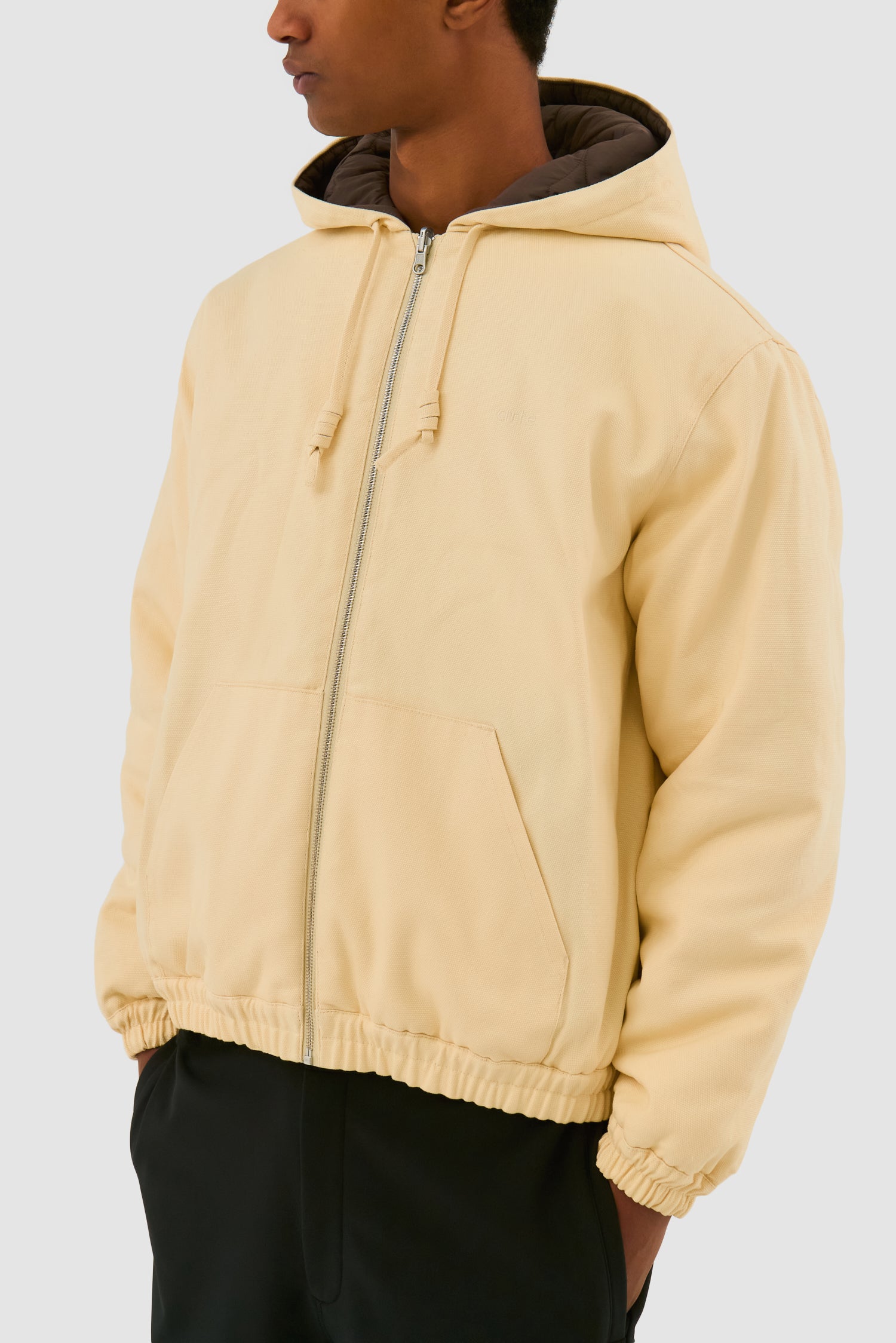 Detail view of Reversible Hooded Jacket in Cream