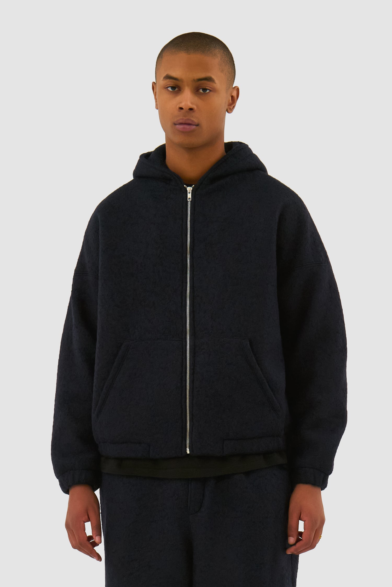 Wool Hooded Jacket in Navy worn by a model, half-body front view