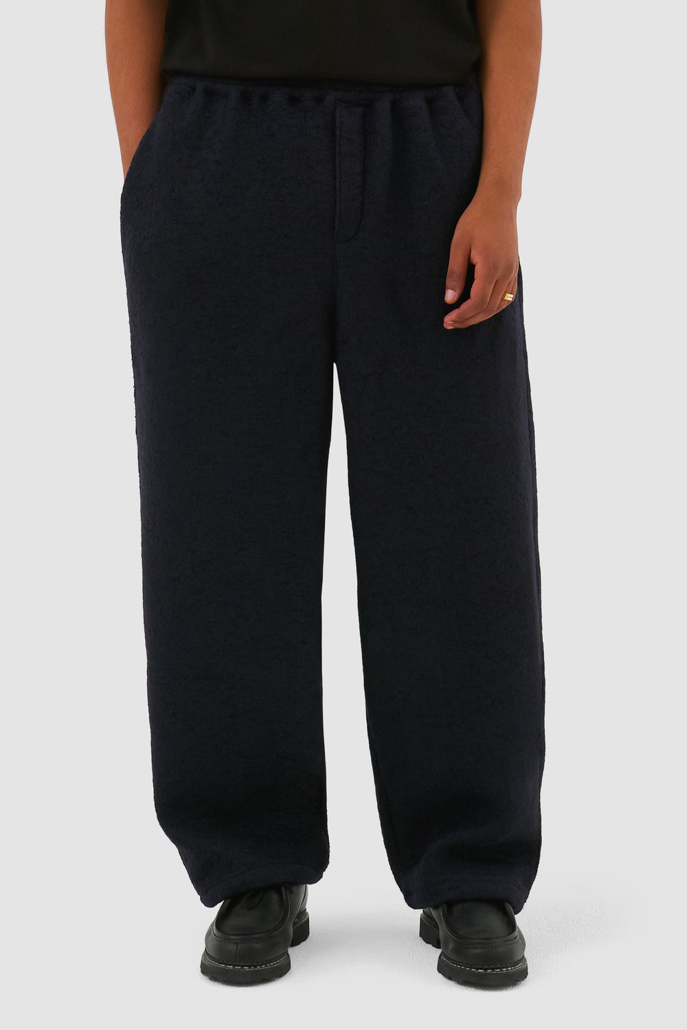 Boiled Wool Pants in Navy worn by a model, half-body front view