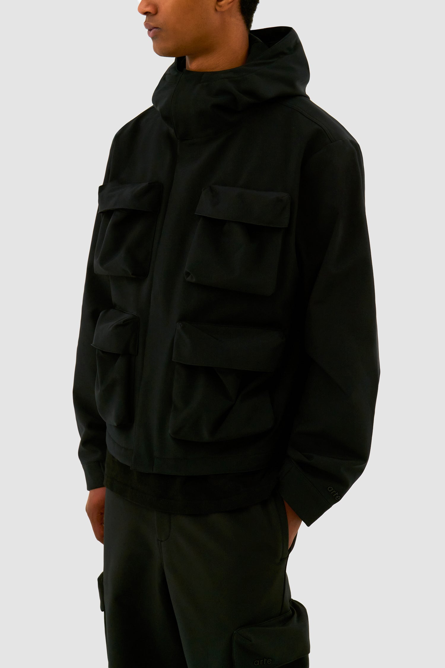 Detail view of 3D Pockets Hooded Nylon Jacket in Black