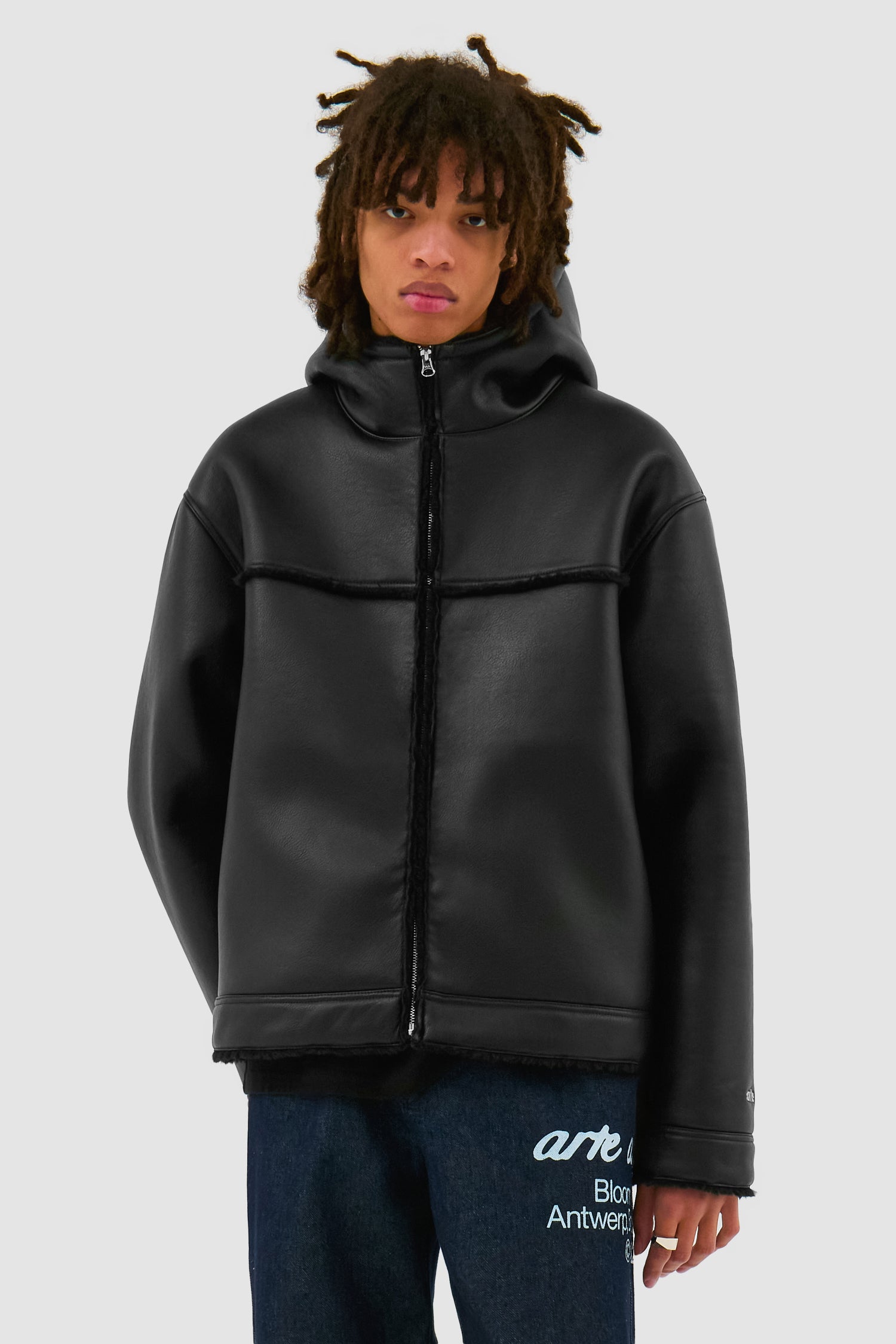 Shearling Jacket in Black worn by a model, half-body front view