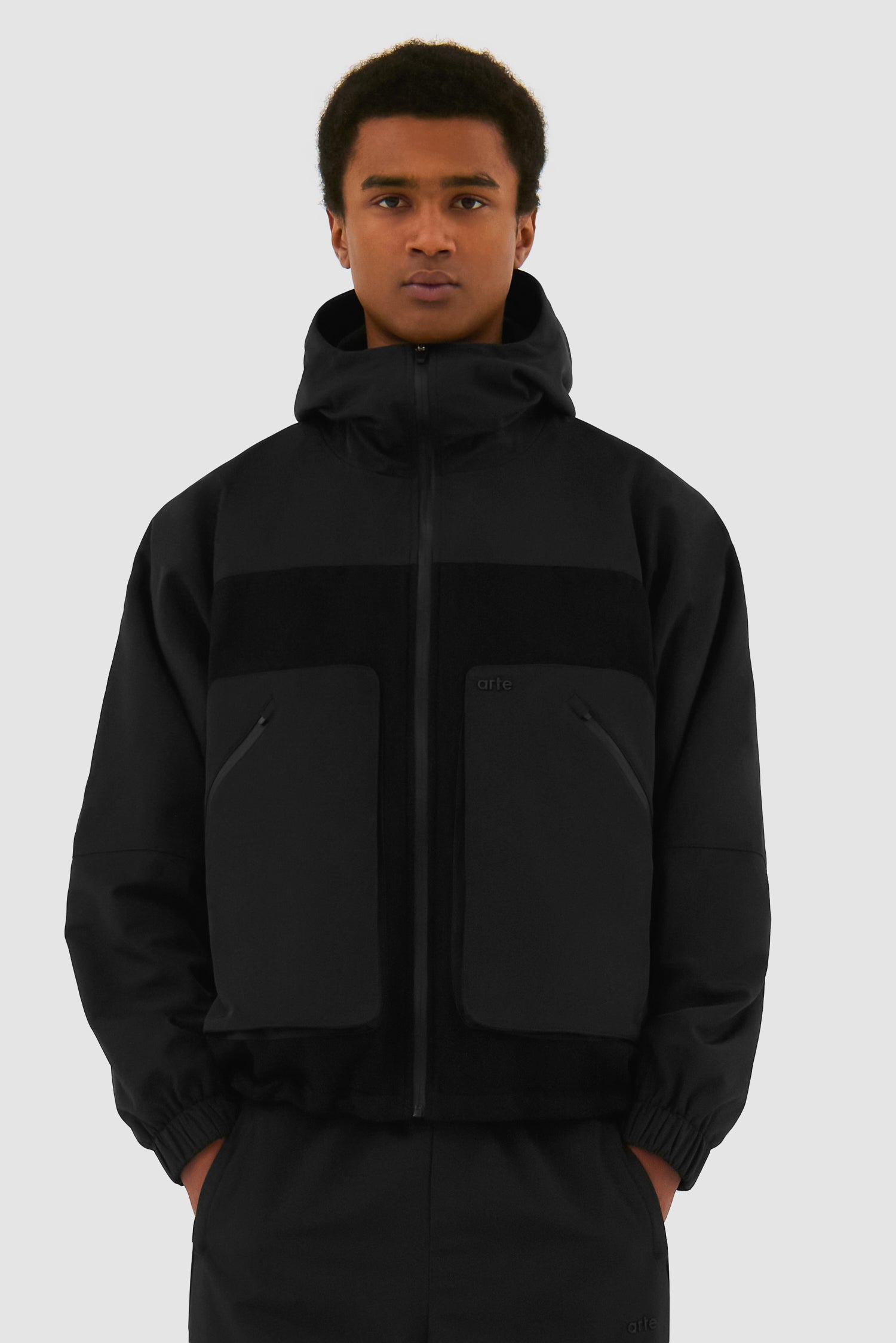 Wool Technical Jacket in Black worn by a model, half-body front view