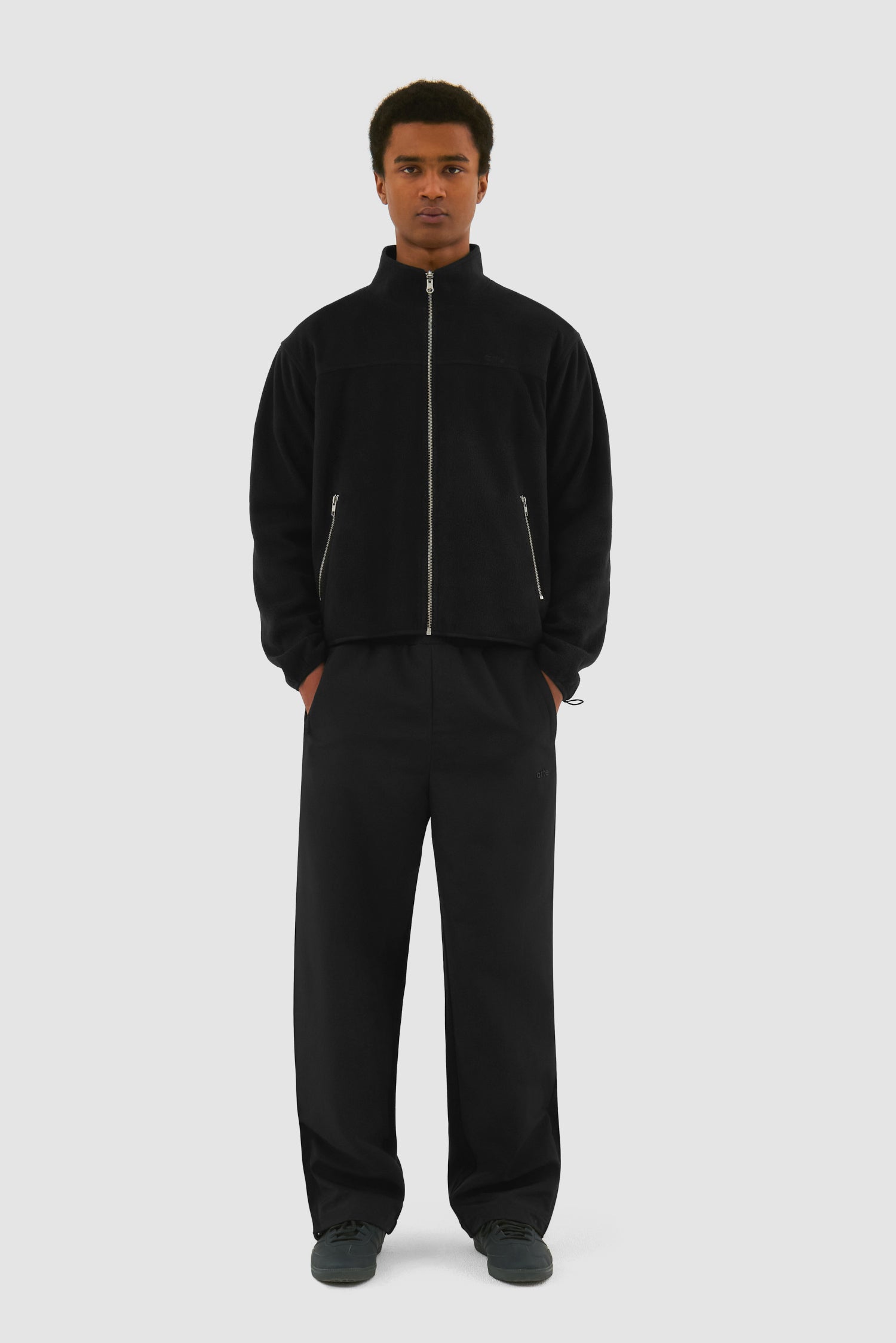 Wool Technical Jacket in Black worn by a model, full-body front view showing the inside layer