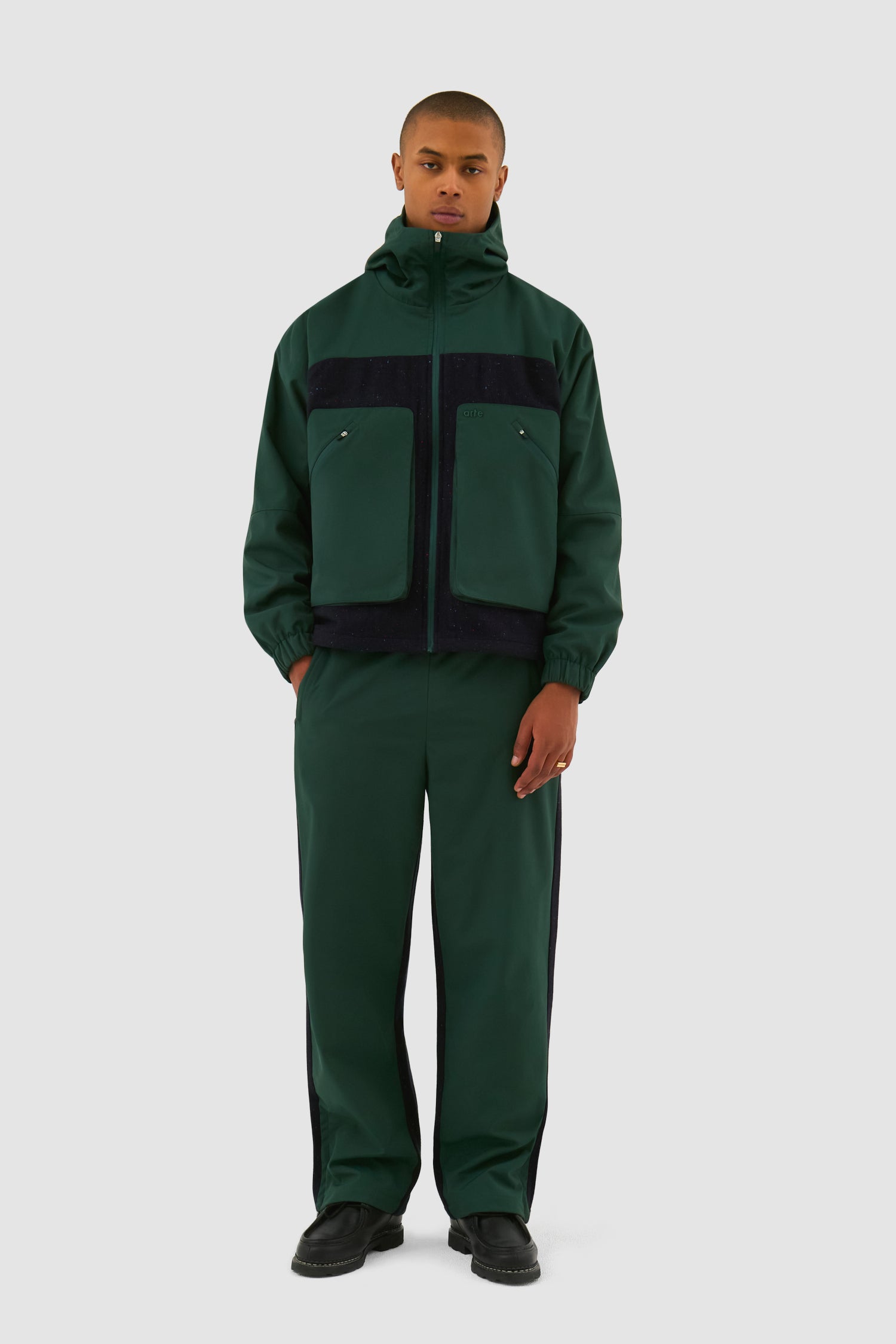 Wool Technical Jacket in Green worn by a model, full-body front view