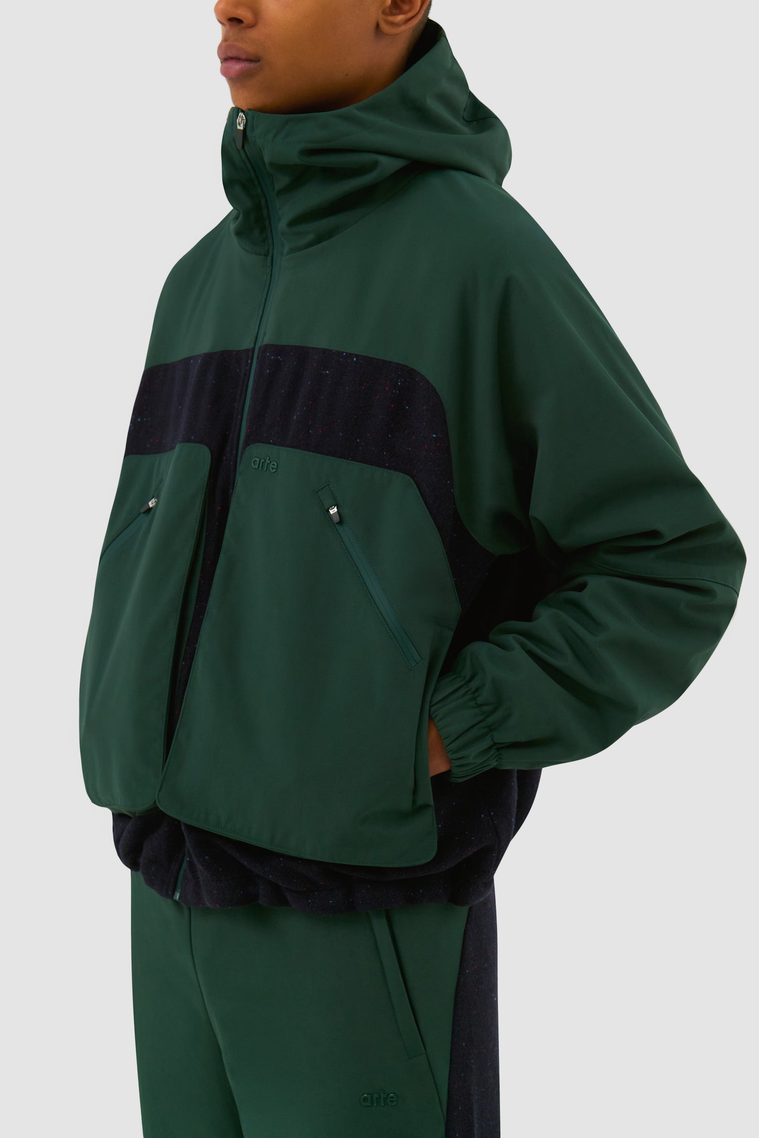 Detail view of Wool Technical Jacket in Green worn by a model, half-body back view
