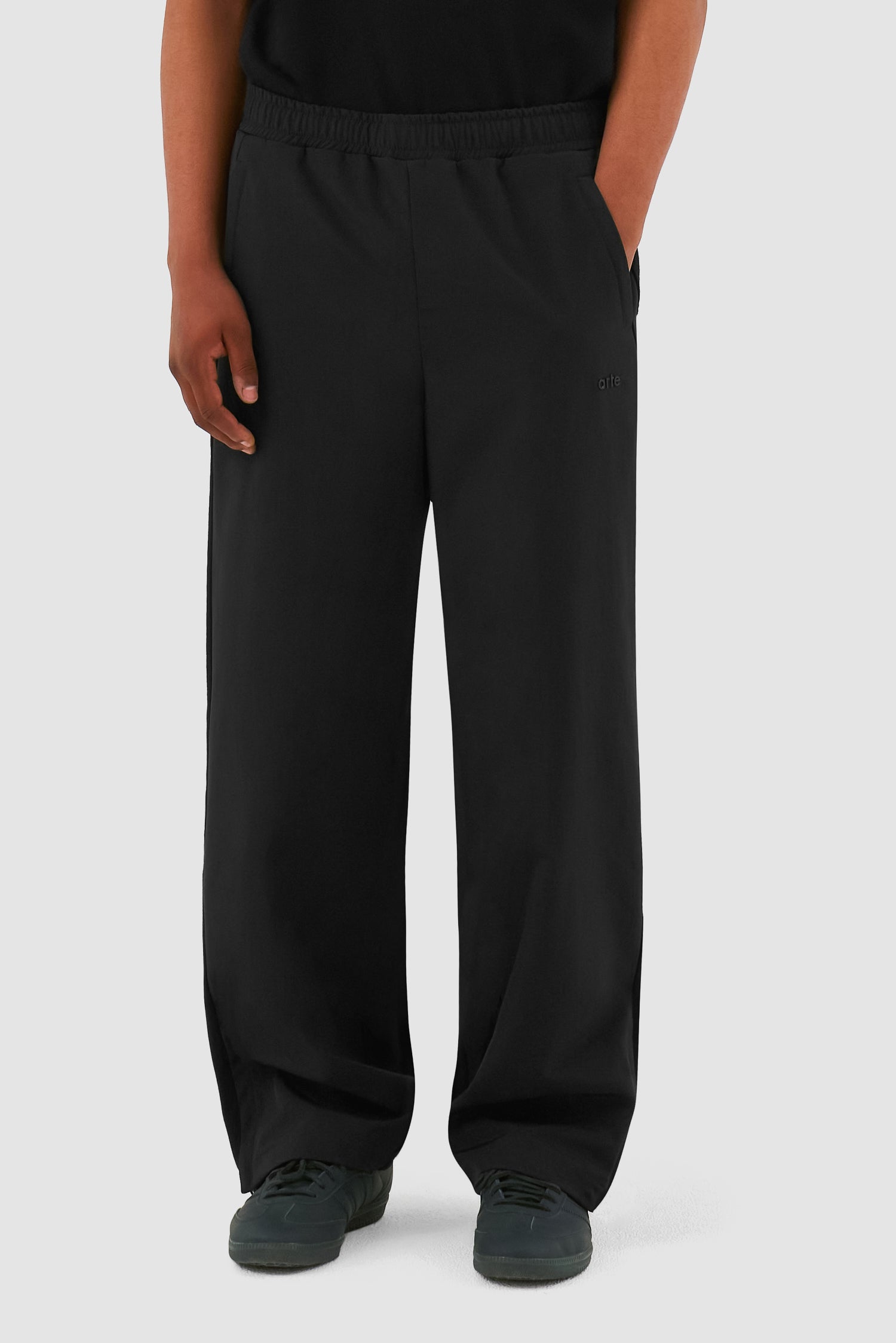 Wool Technical Pants in Black worn by a model, half-body front view