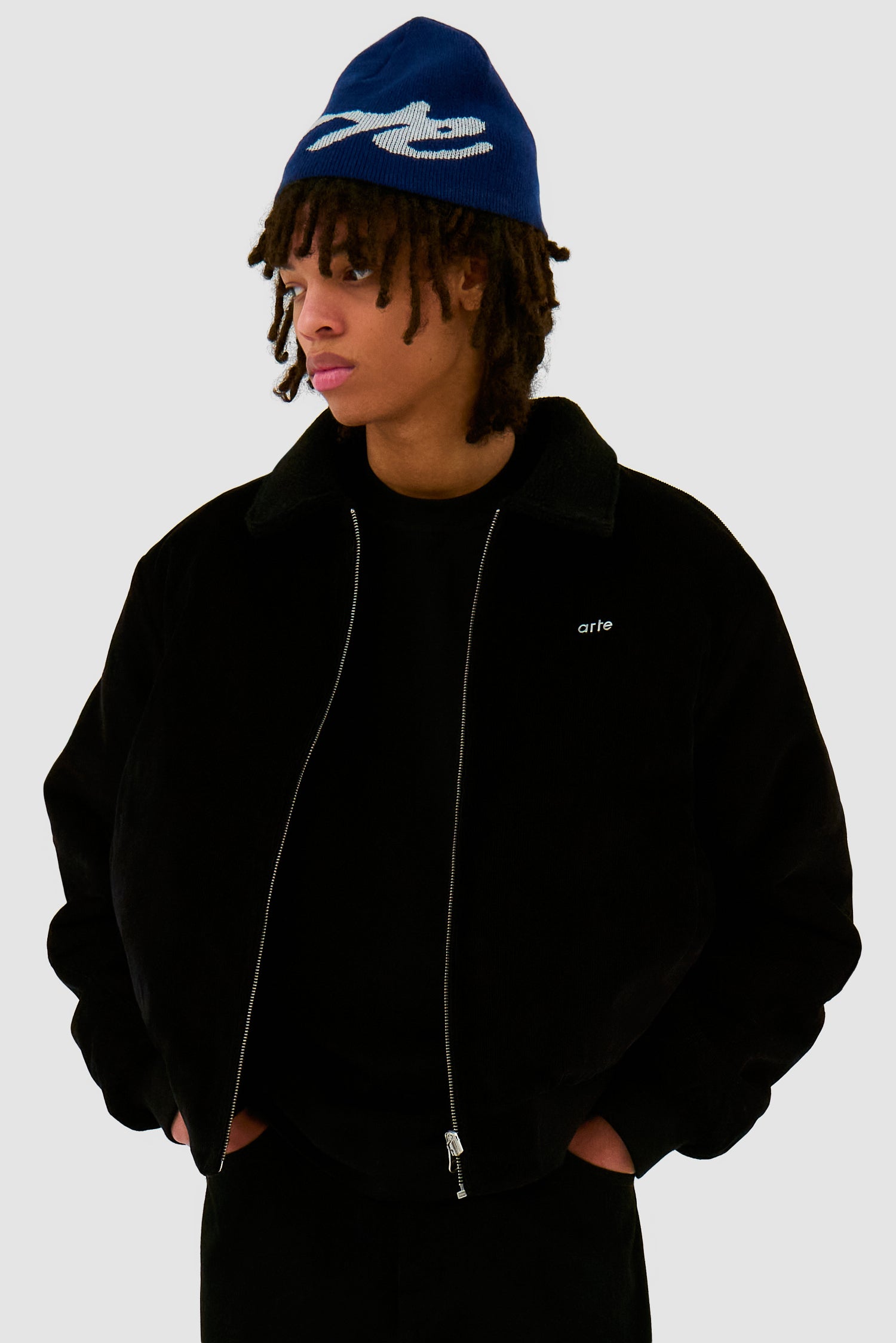 Big Logo Beanie in Navy worn by a model, half-body front view