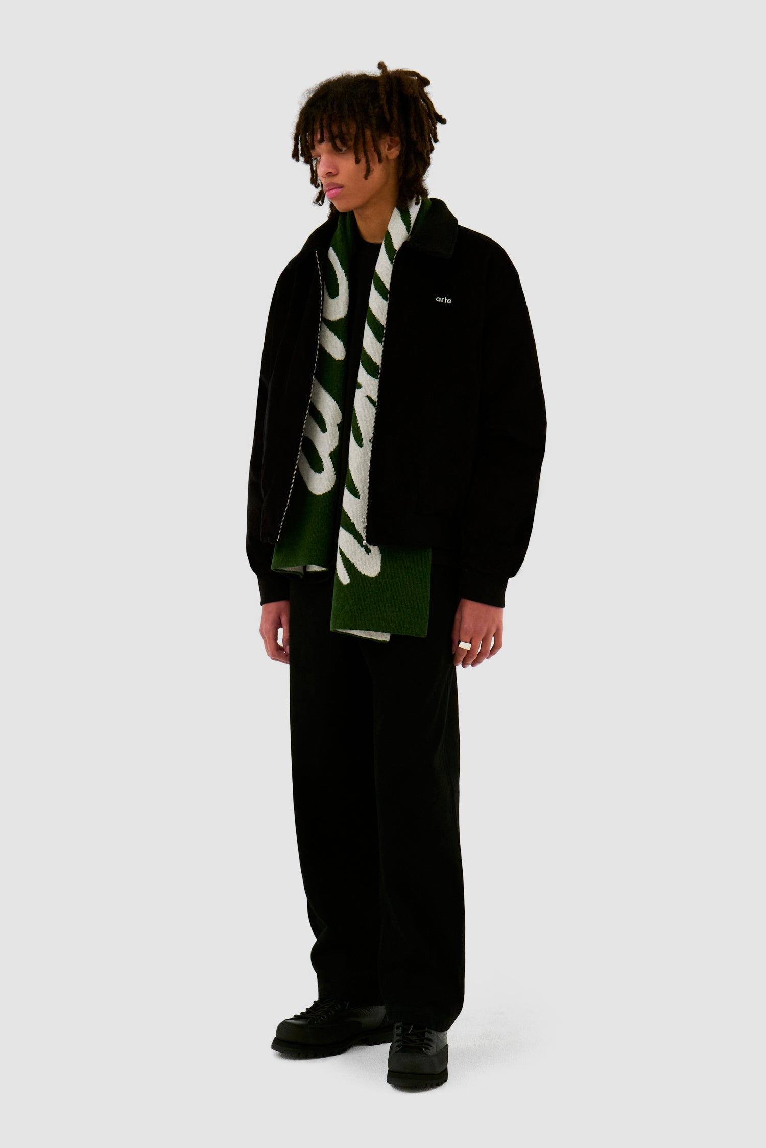 Antwerp Scarf in Green worn by a model, full-body front view