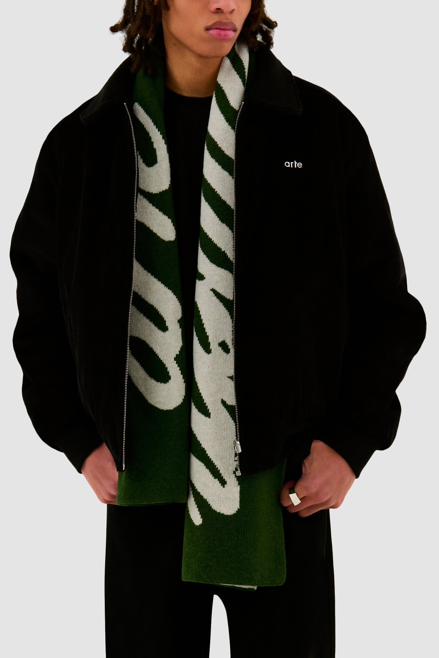 Antwerp Scarf in Green worn by a model, full-body side view