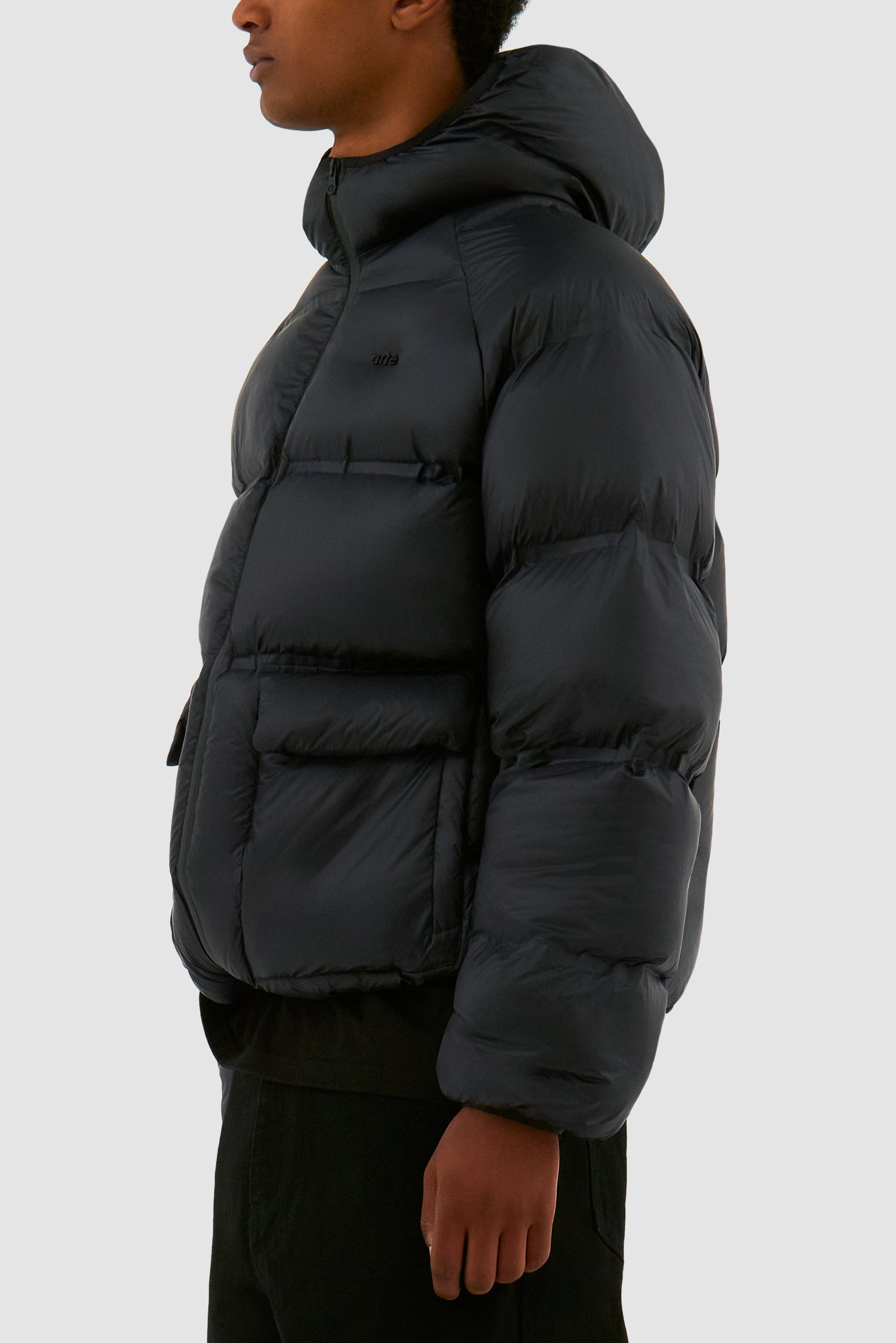 Detail view of Crop Puffer Jacket in Black