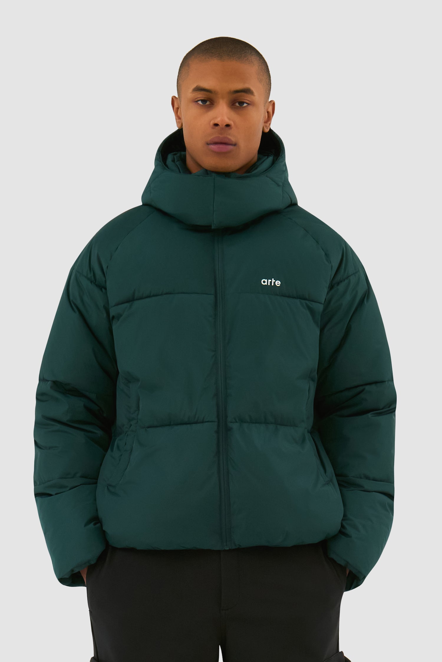Puffer Jacket in Green worn by a model, half-body front view