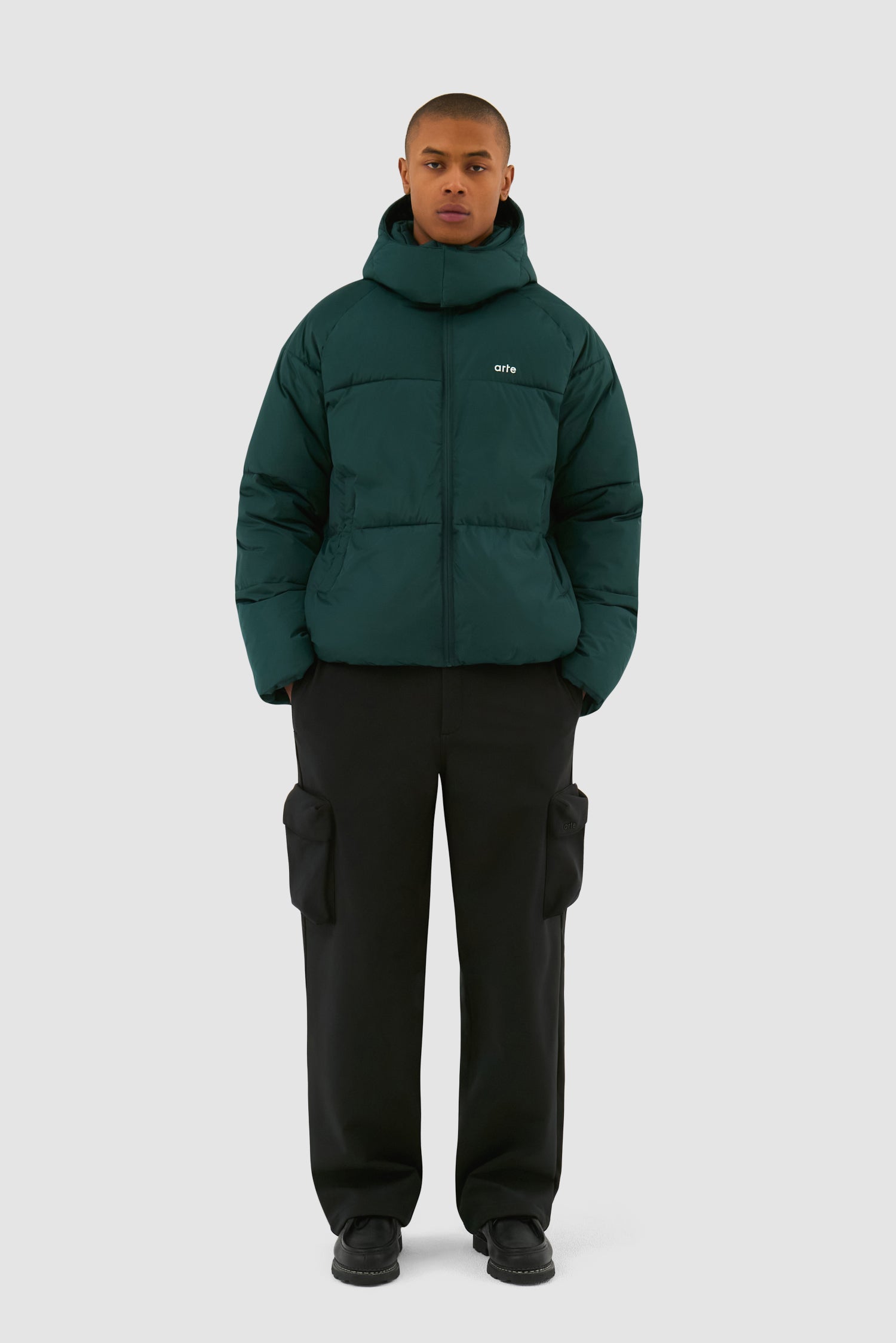 Puffer Jacket in Green worn by a model, full-body front view