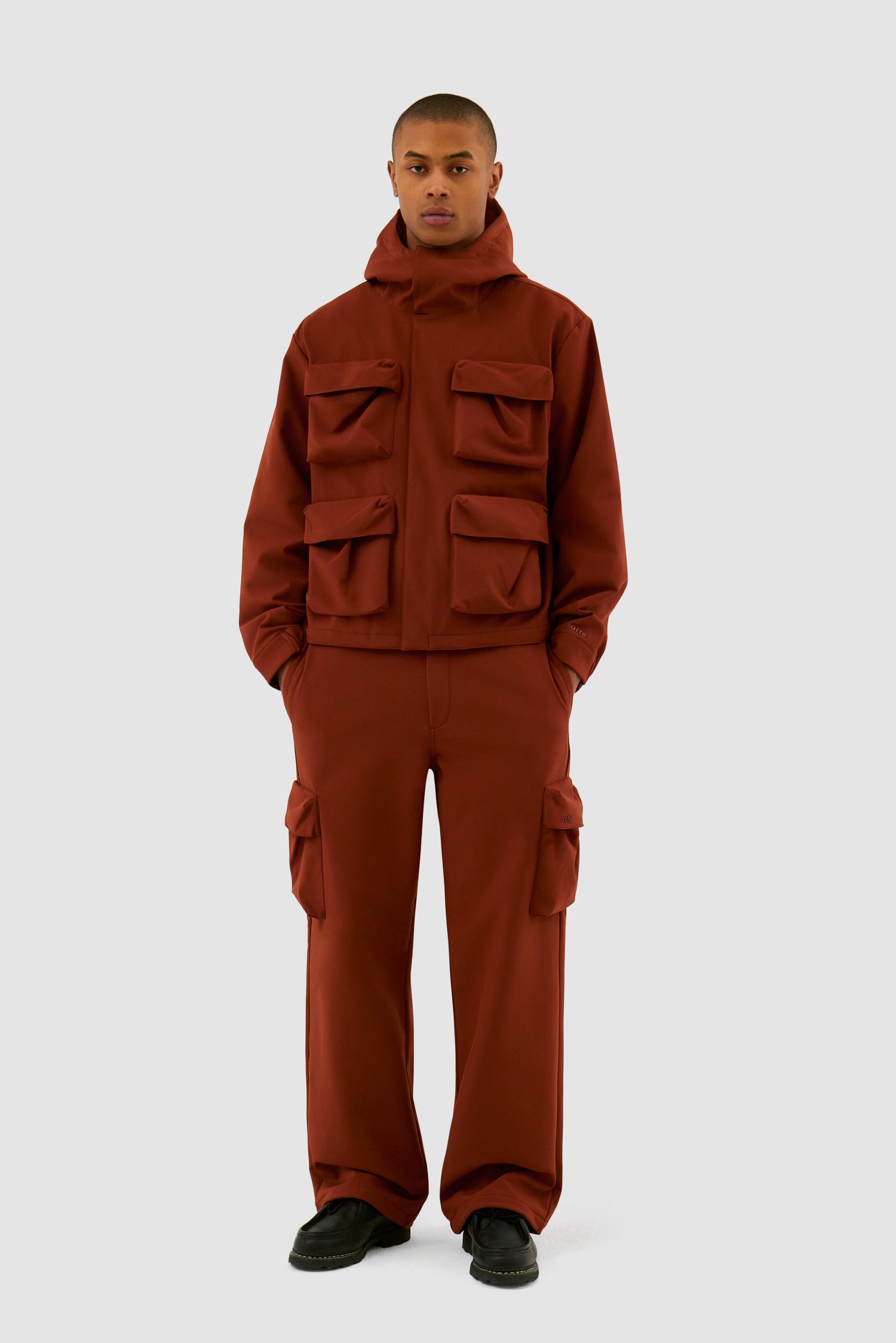 3D Pockets Hooded Nylon Jacket in Orange worn by a model, full-body front view