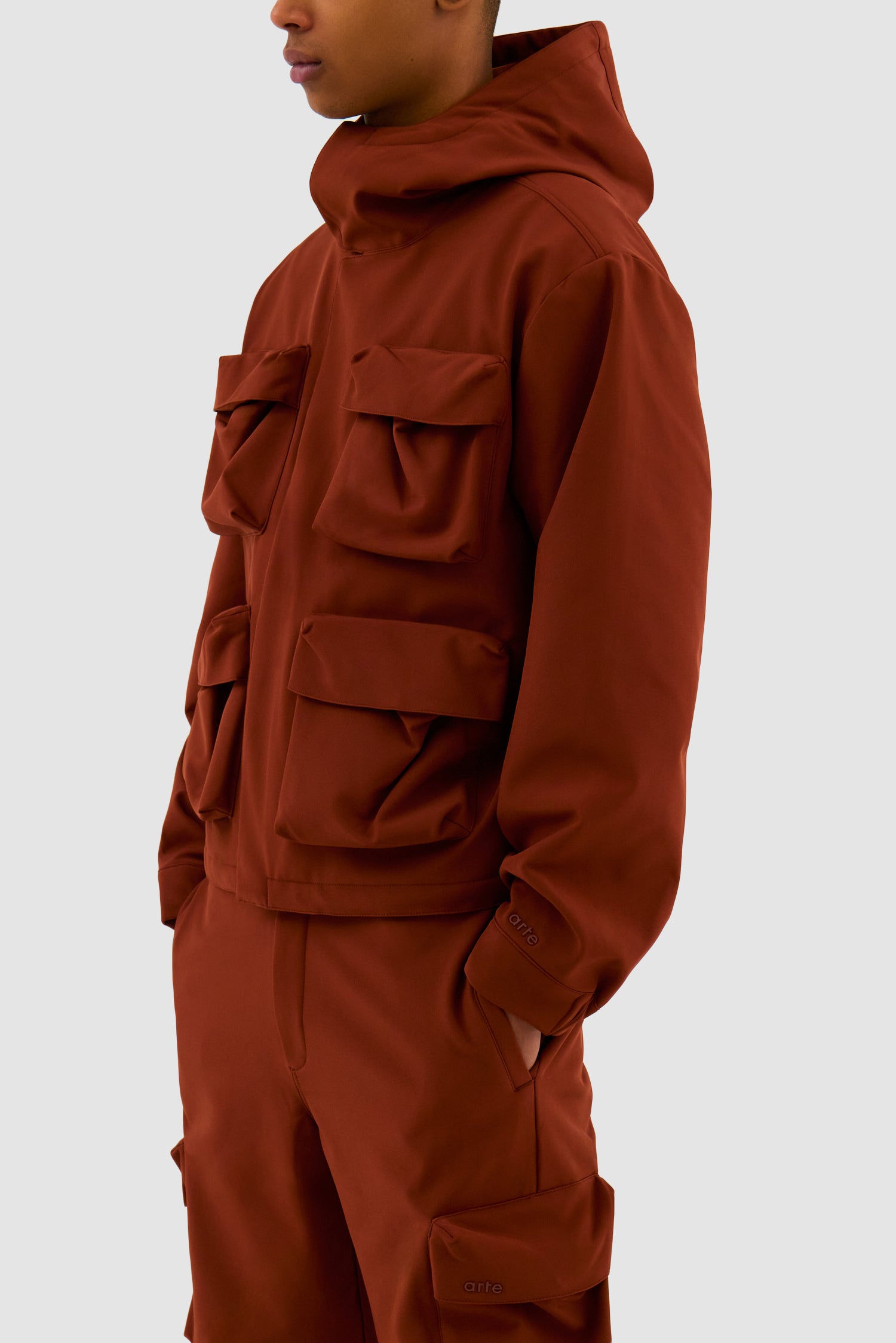 Detail view of 3D Pockets Hooded Nylon Jacket in Orange