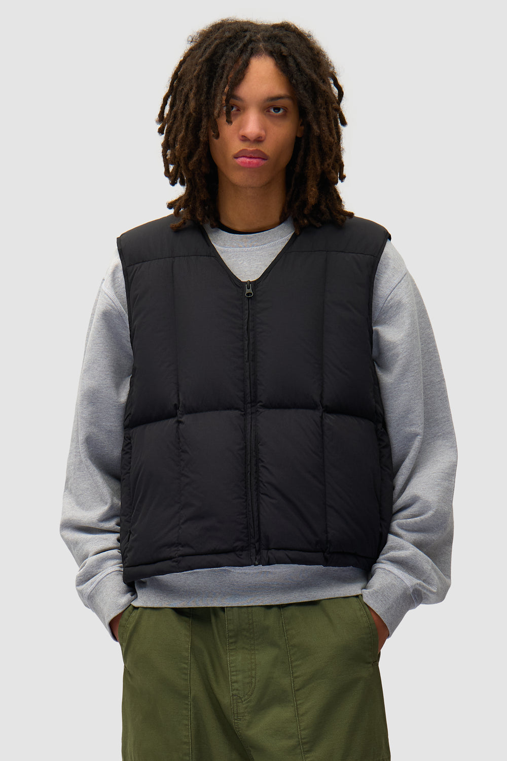 Puffer Vest in Black worn by a model, half-body front view