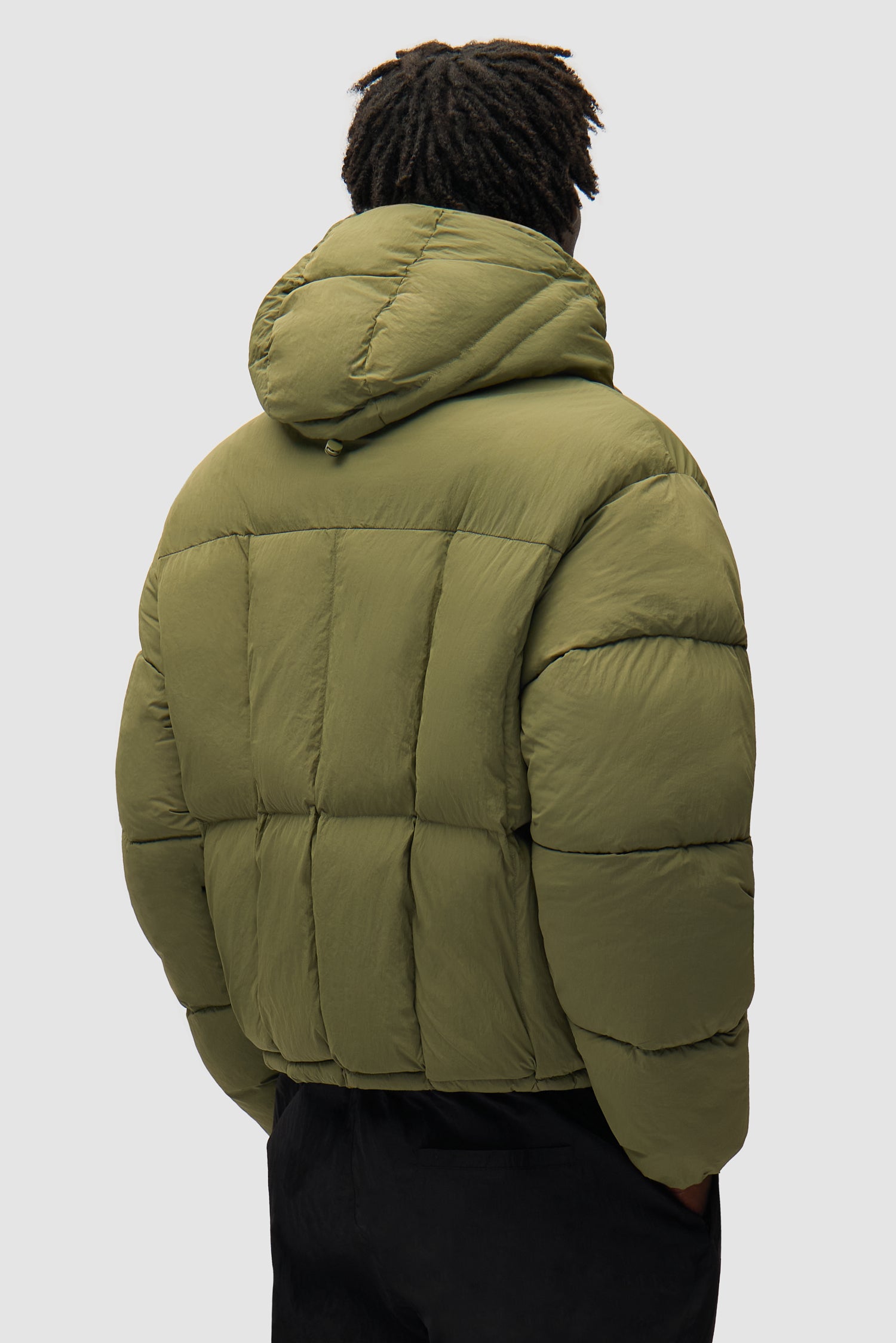 Special Cuts Puffer Jacket in Green worn by a model, half-body front