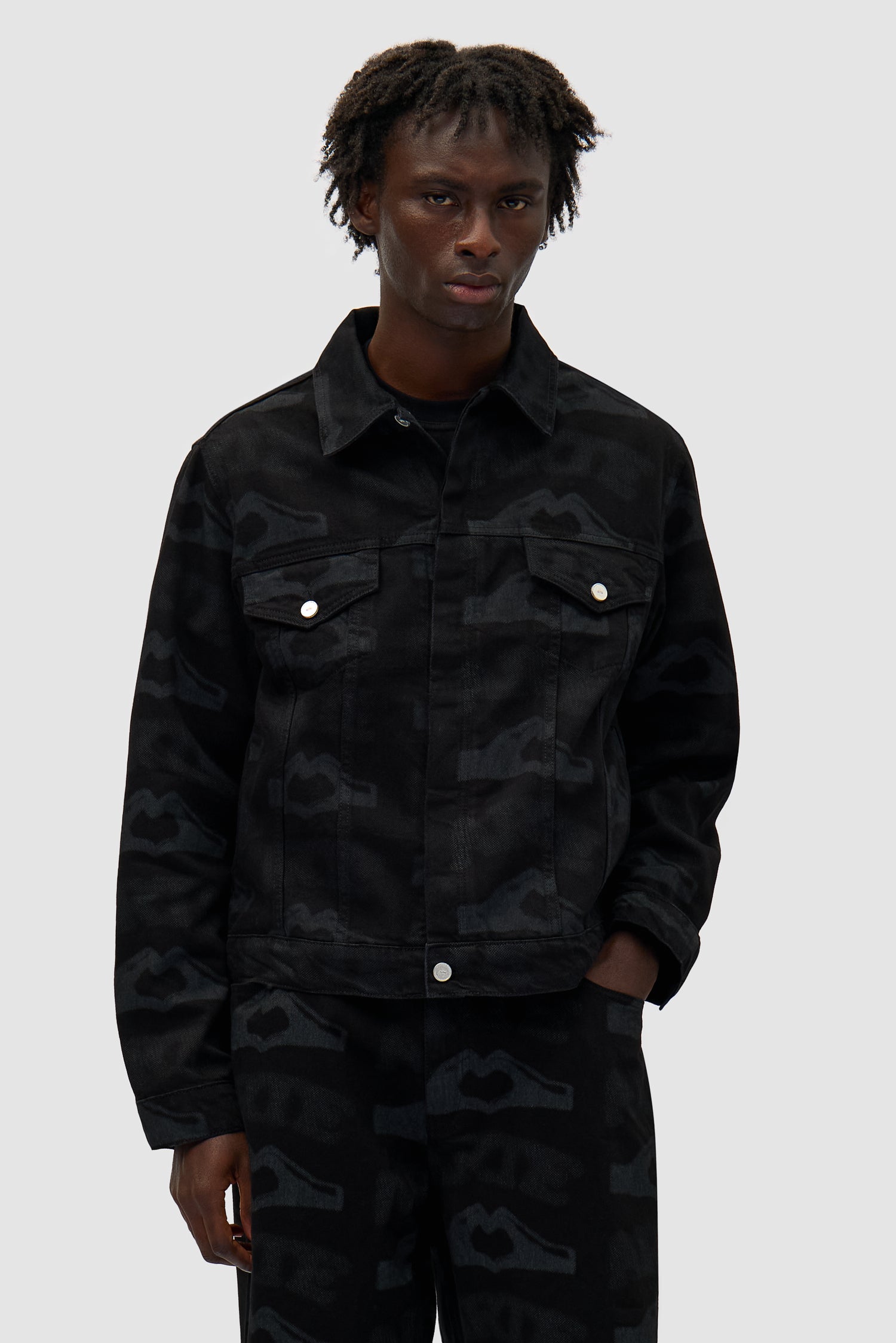 Heart Printed Jacket in Black worn by a model, half-body front view