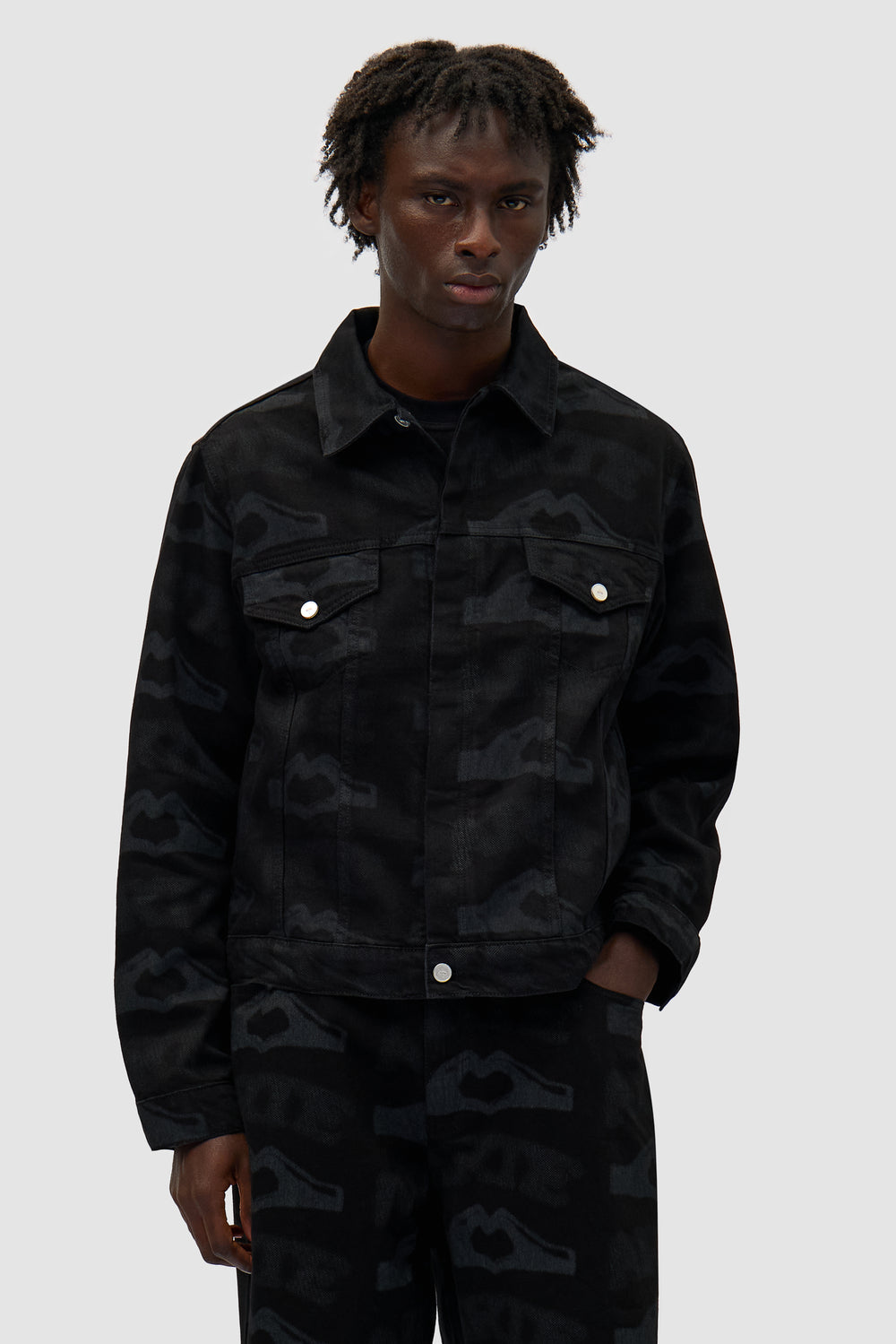 Heart Printed Jacket in Black worn by a model, half-body front view