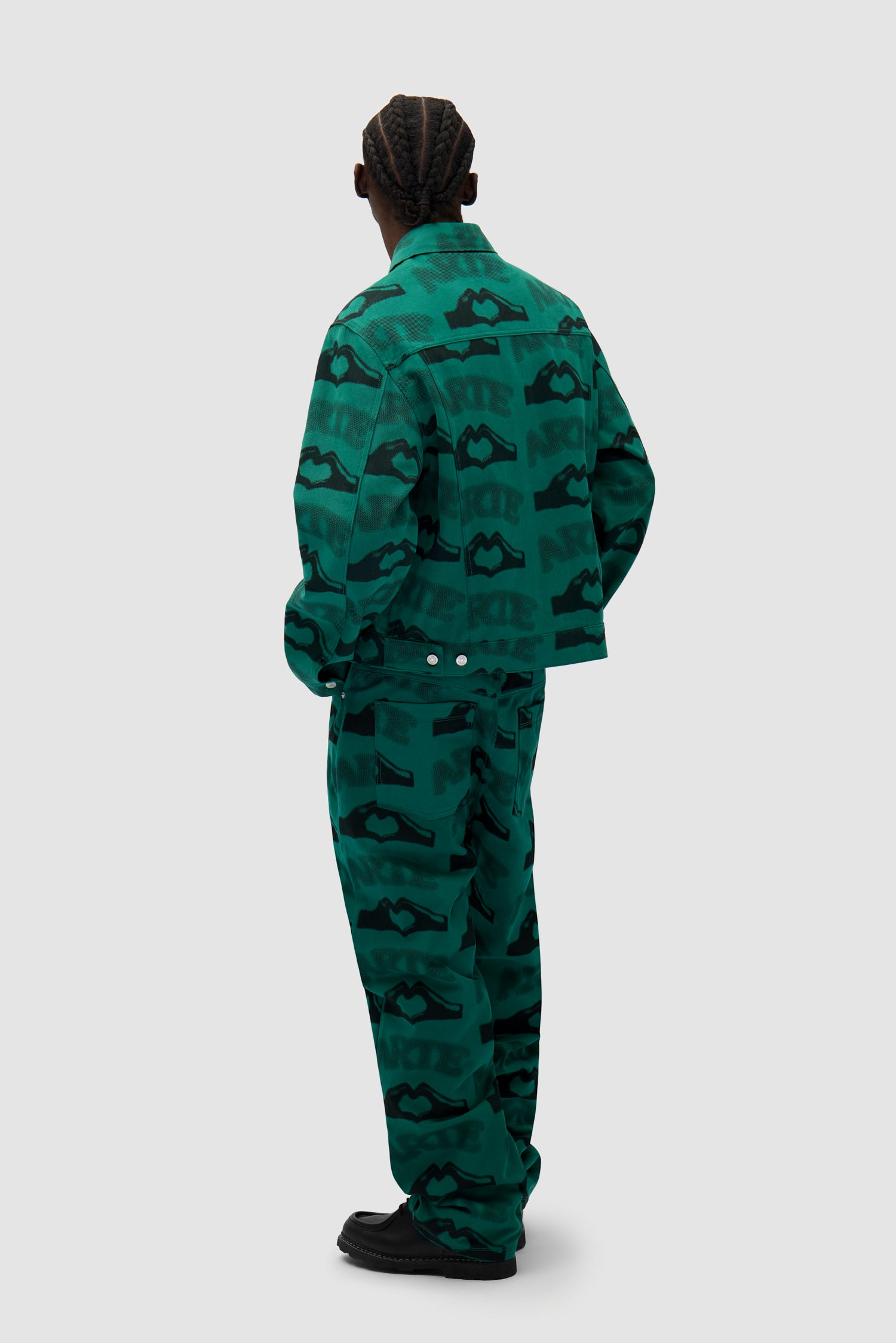 Heart Printed Pants in Green worn by a model, full-body back view