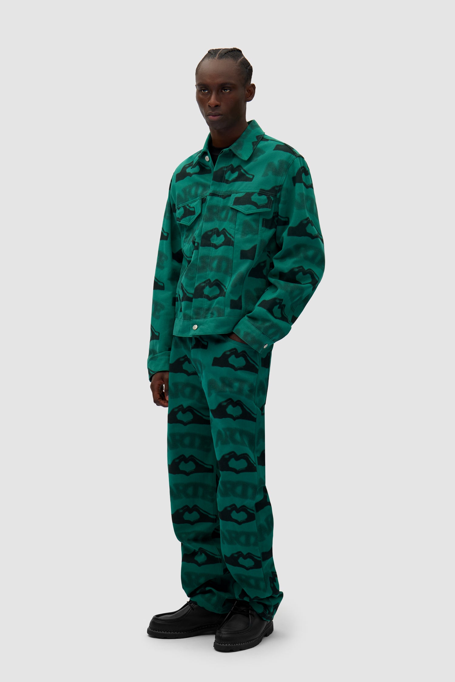 Heart Printed Pants in Green worn by a model, full-body side view