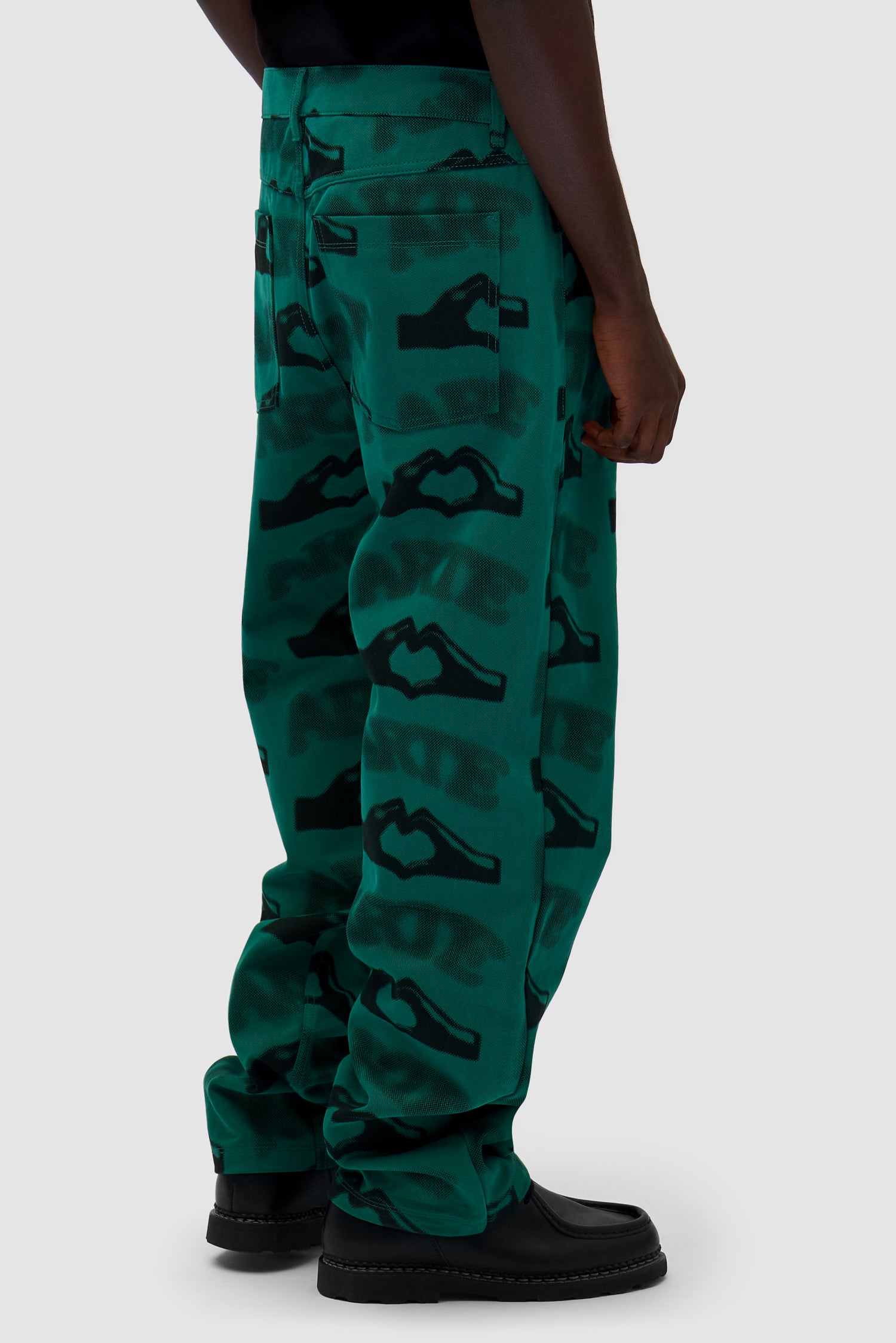 Heart Printed Pants in Green worn by a model, half-body back view