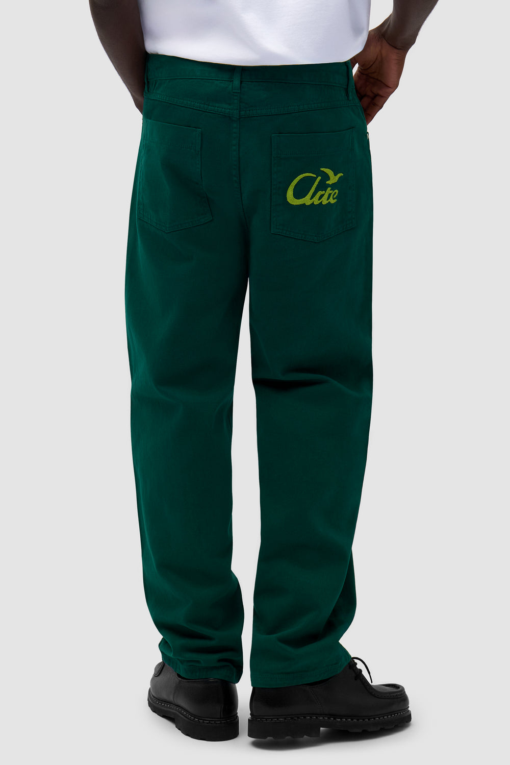 Back Bird Pants in Green worn by a model, half-body front view