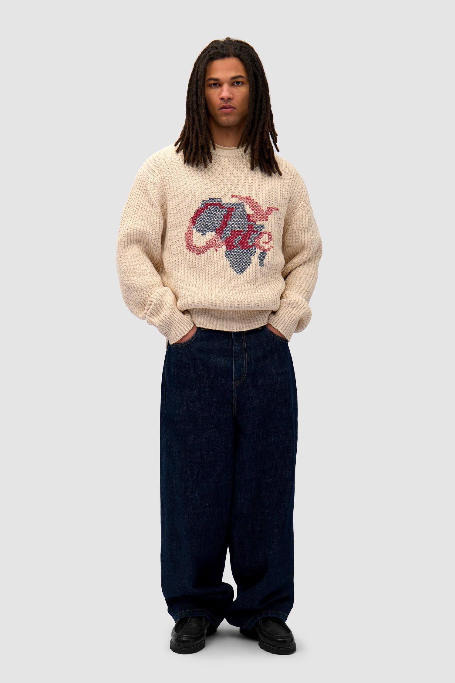 Cross Stitch Knit in Cream worn by a model, full-body front view