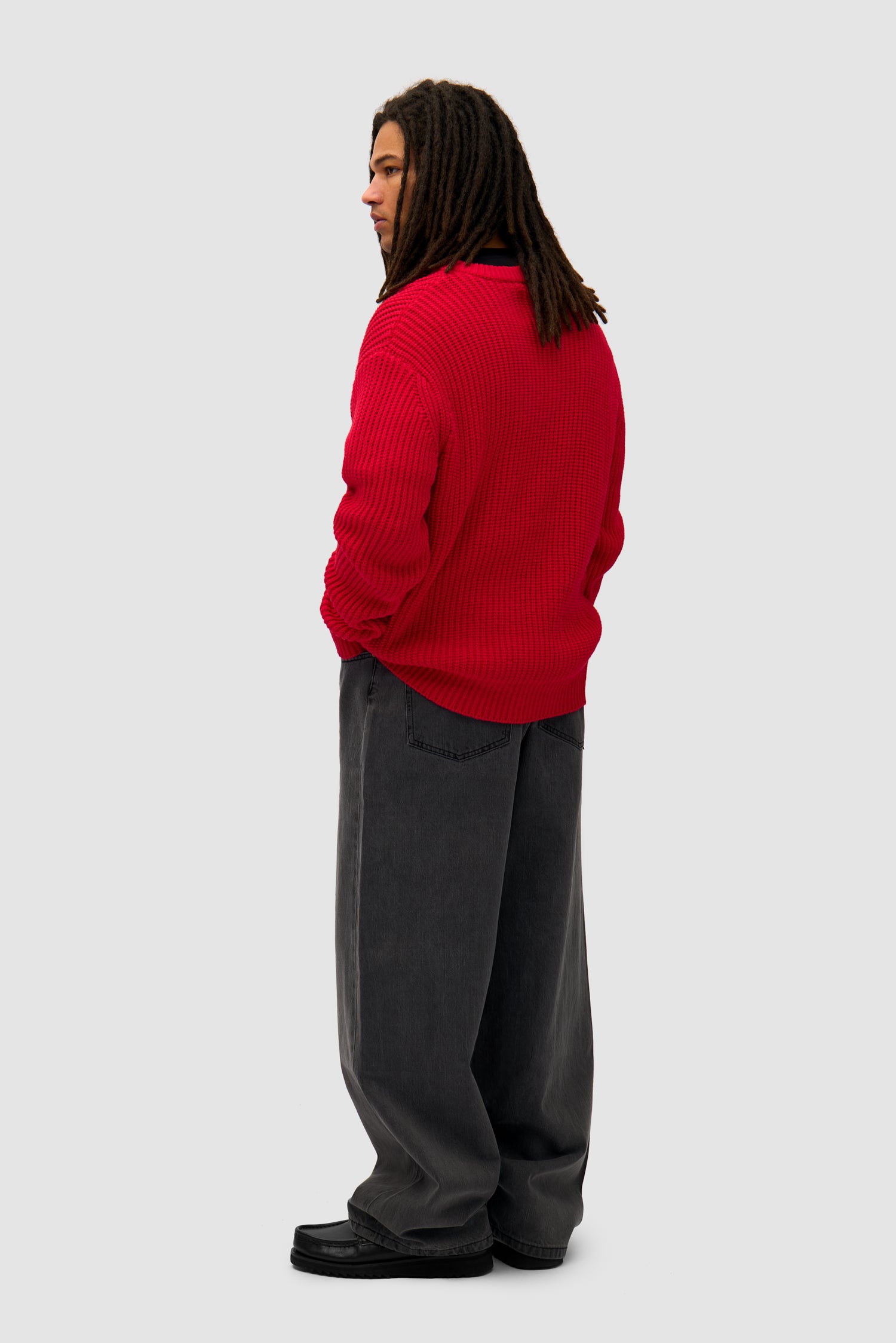 Cross Stitch Knit in Red worn by a model, full-body back view