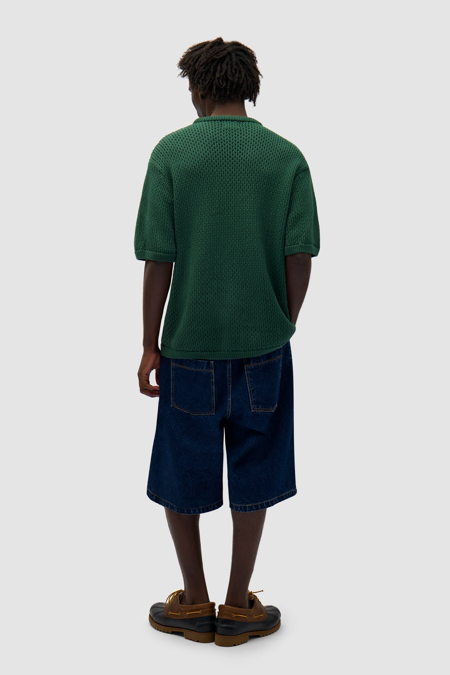 Crochet Knit T-shirt in Green worn by a model, full-body back view