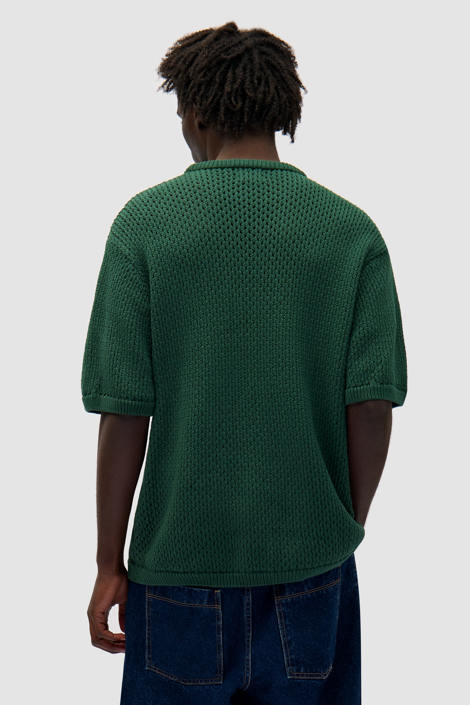 Crochet Knit T-shirt in Green worn by a model, half-body back view