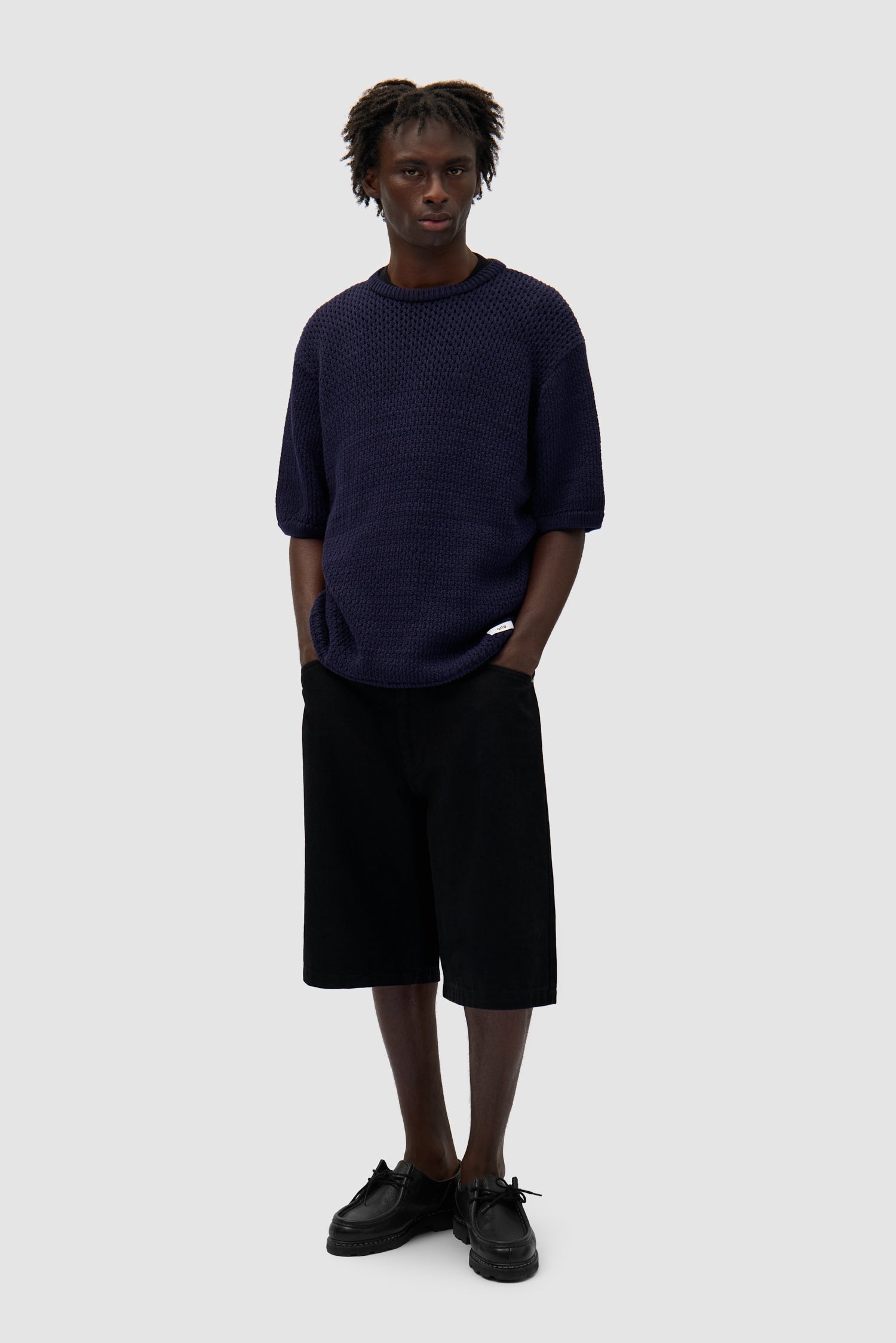 Crochet Knit T-shirt in Navy worn by a model, full-body front view