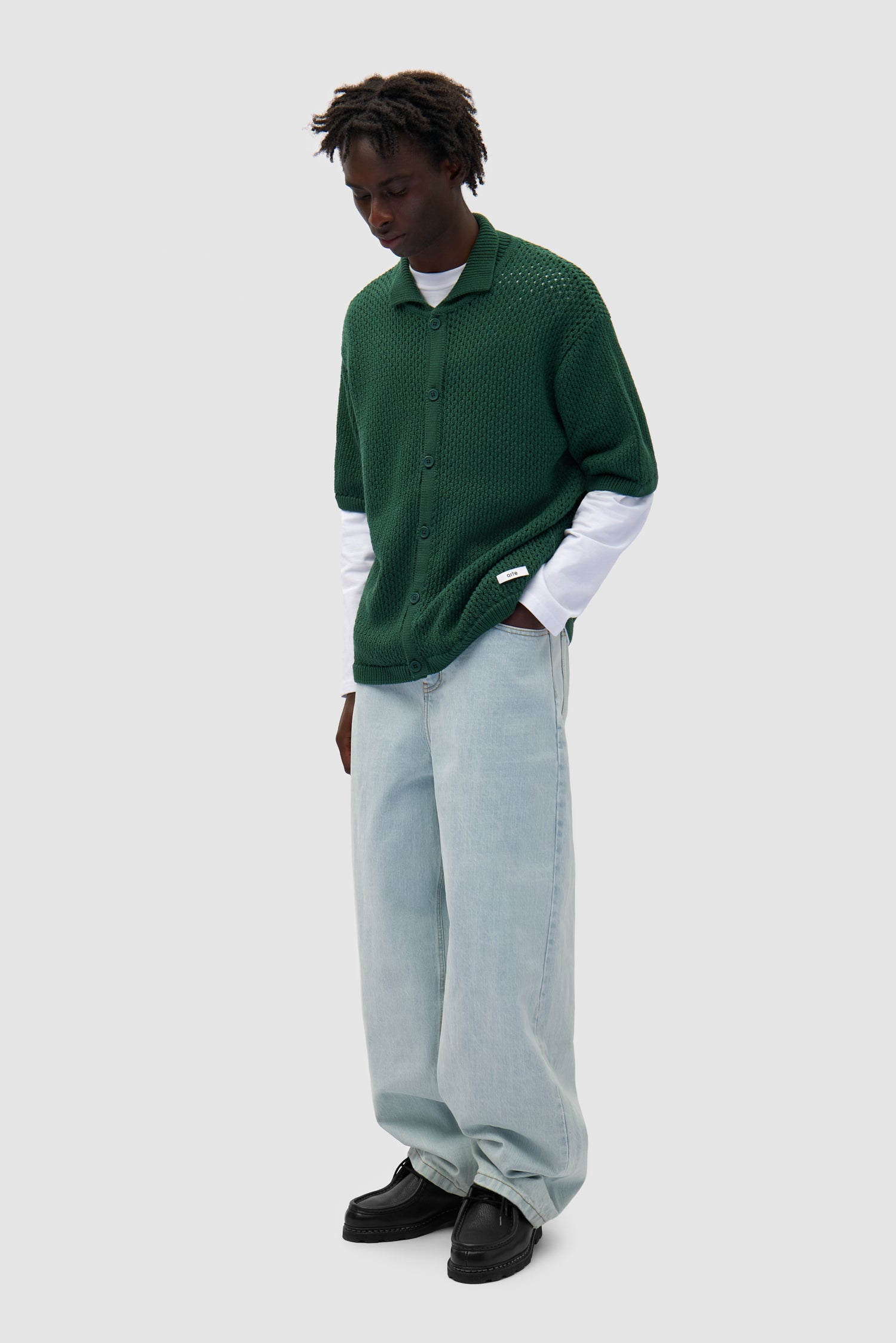 Crochet Knit Button Shirt in Green worn by a model, full-body side view