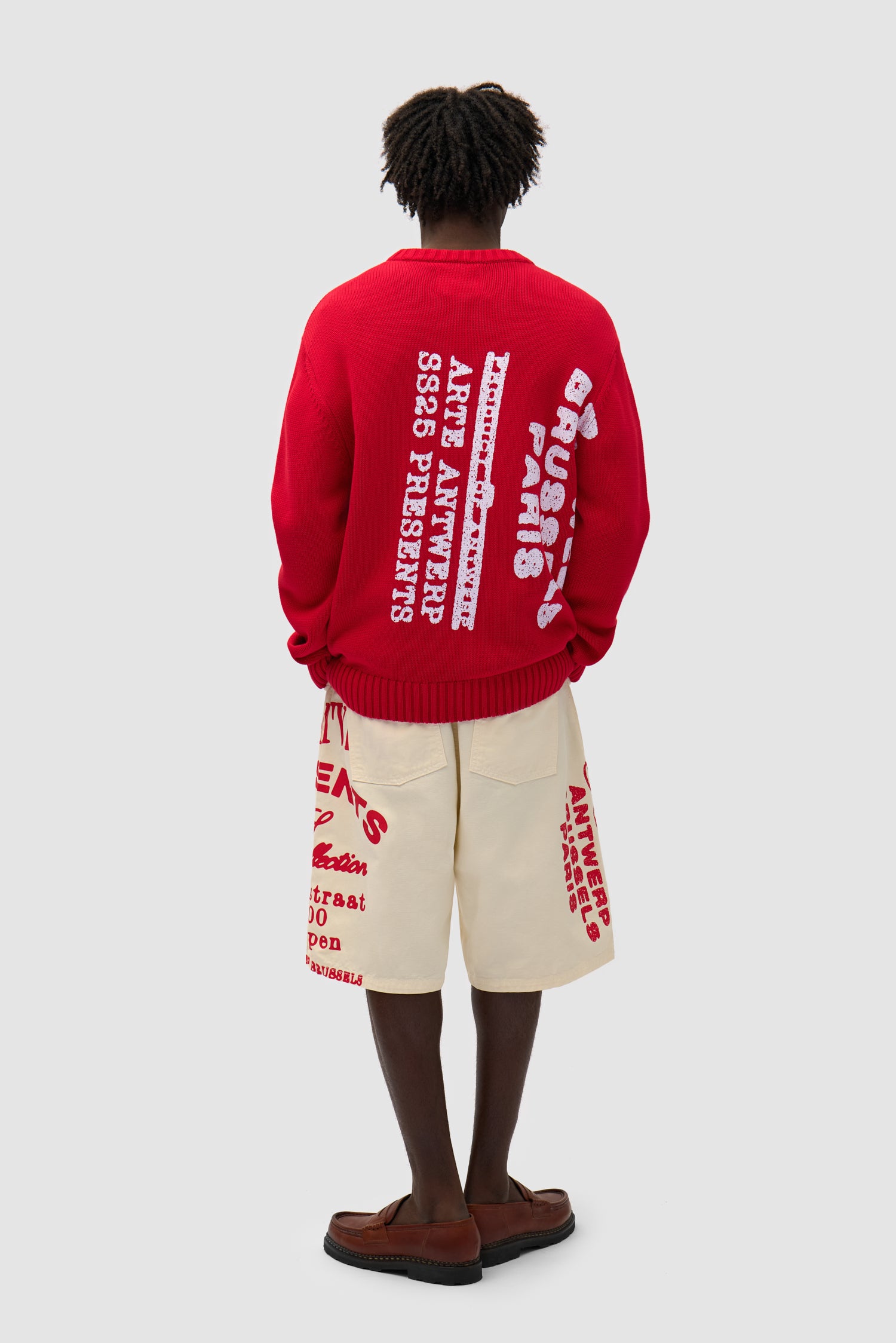 Big Print Knit Sweater in Red worn by a model, full-body back view