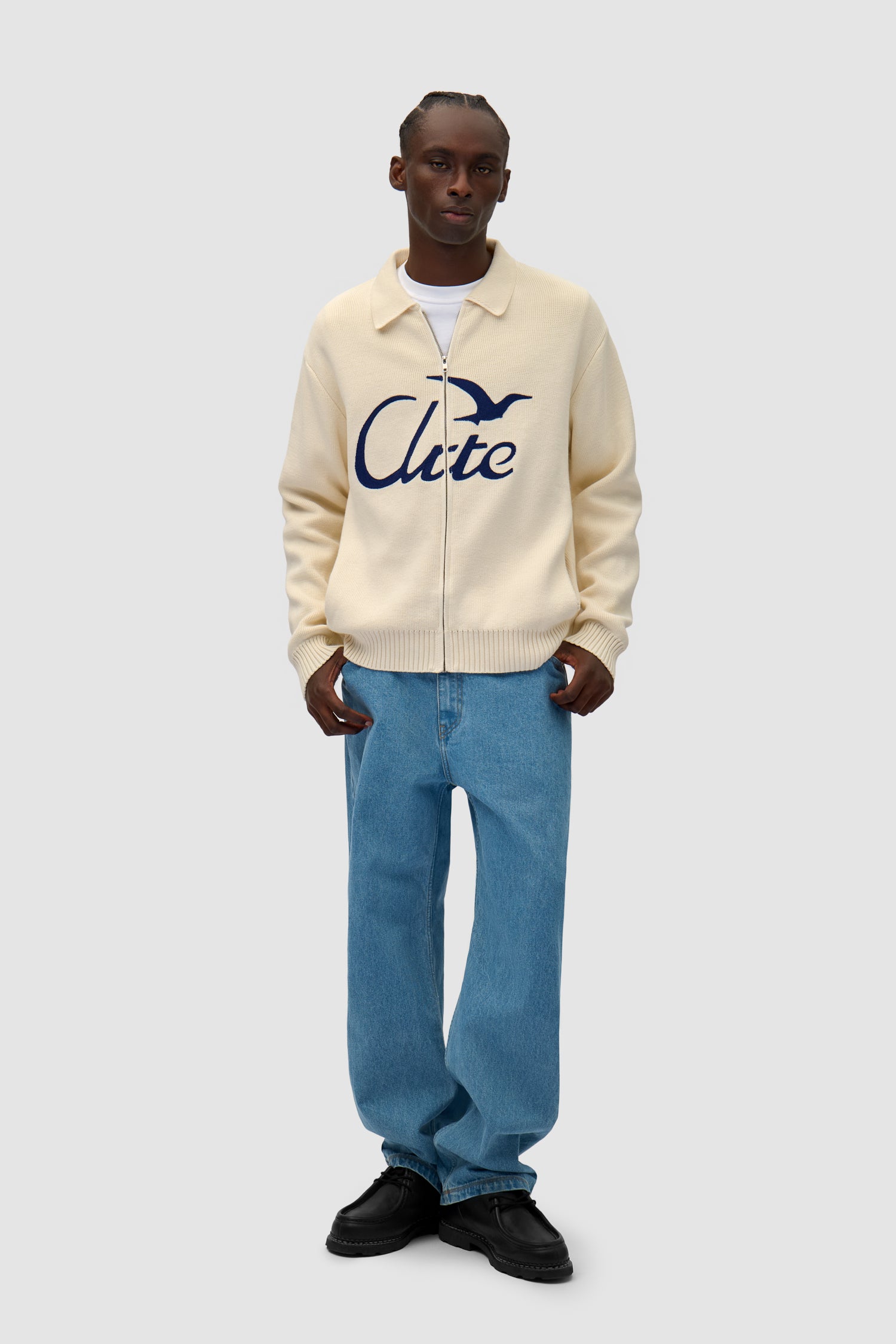 Bird Logo Knit in Cream worn by a model, full-body front view