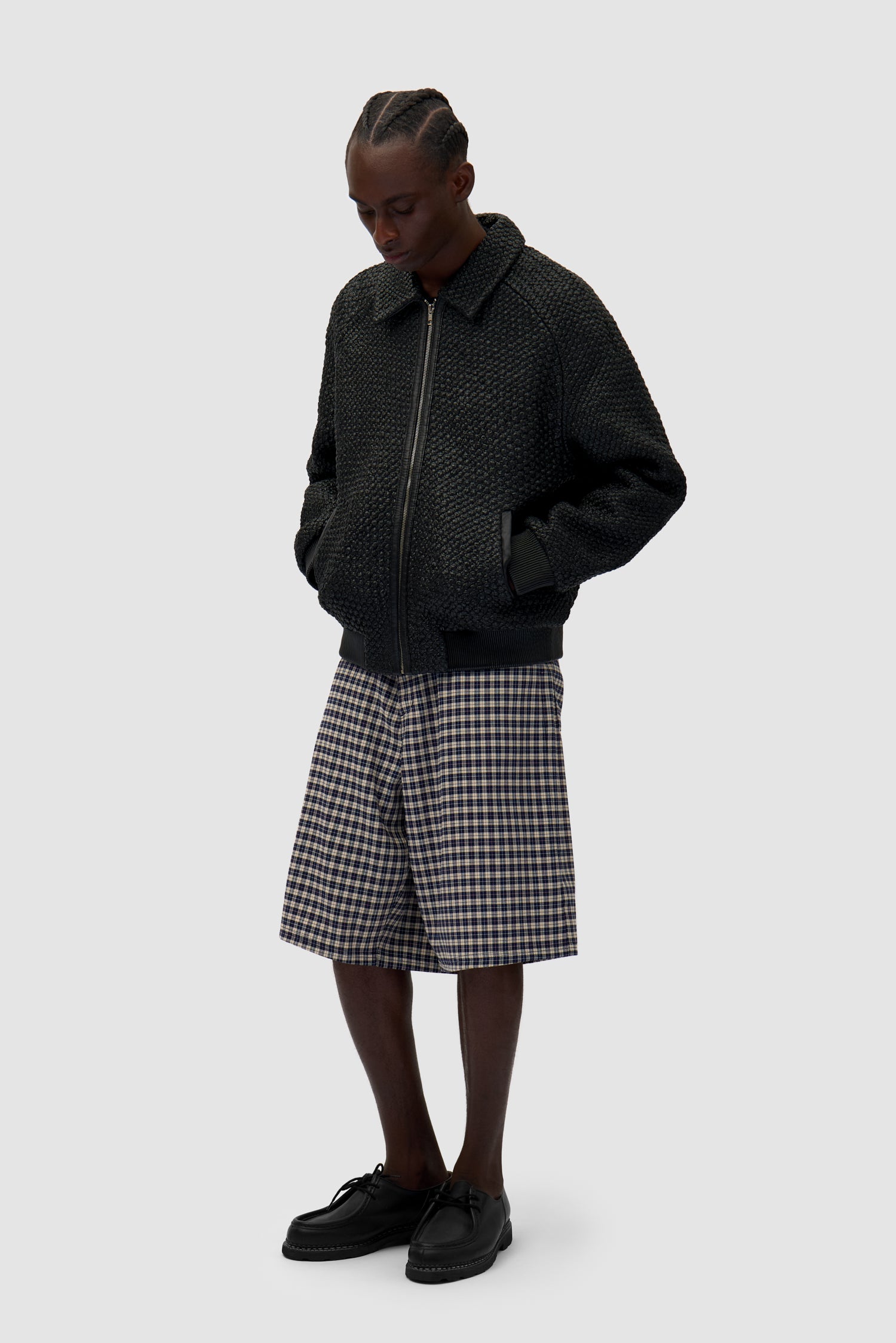 Leather Braided Jacket in Black worn by a model, full-body side view