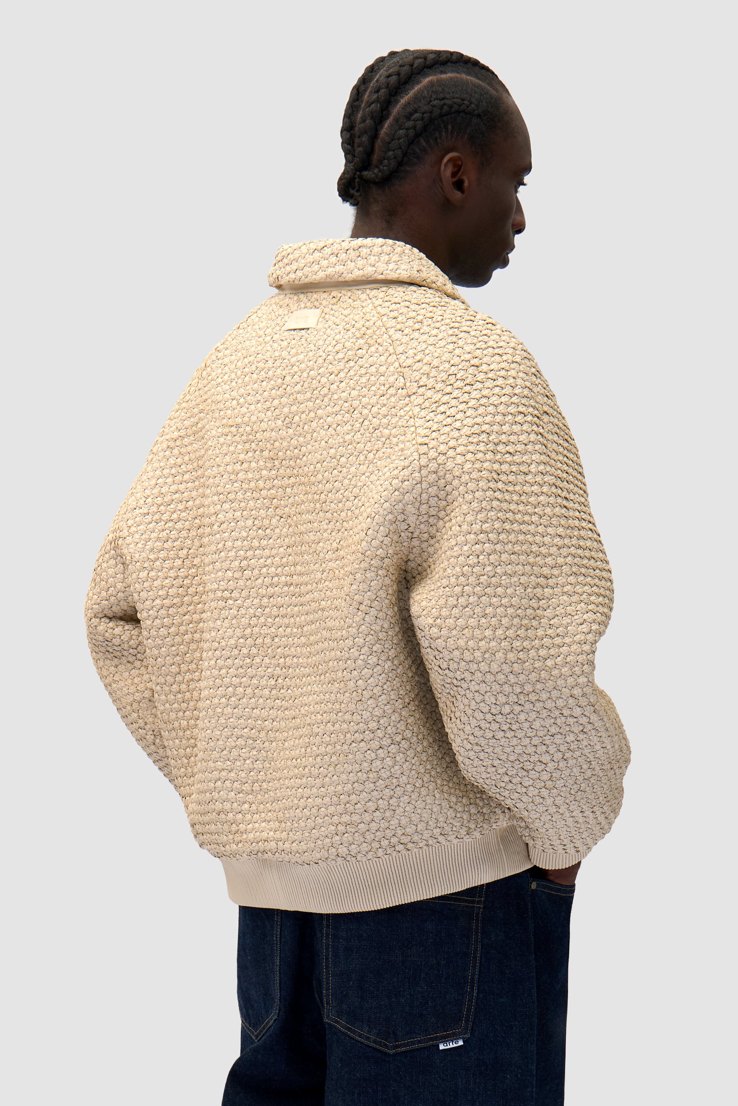 Leather Braided Jacket in Cream worn by a model, half-body back view