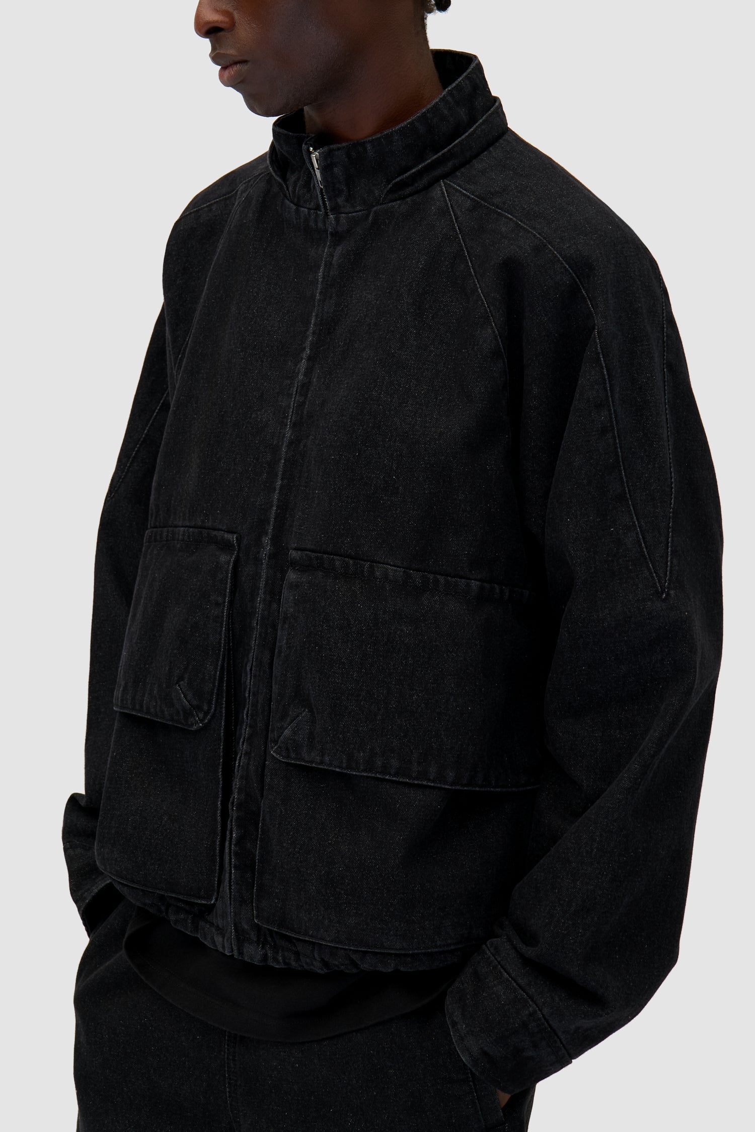 Denim Tech jacket in Black worn by a model, half-body detailed view
