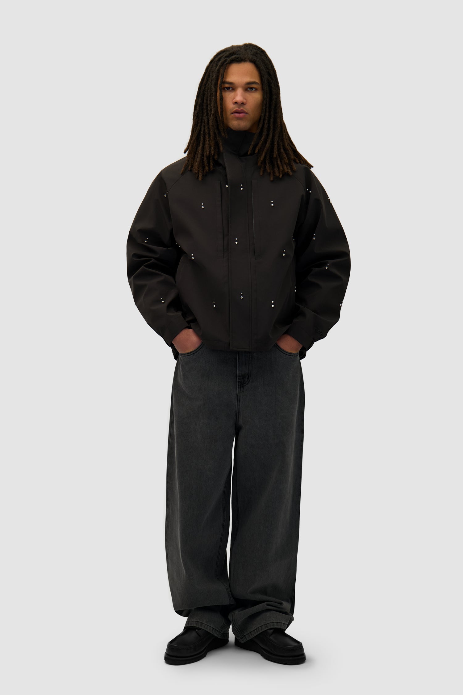 Technical Revits Jacket in Black worn by a model, full-body front view