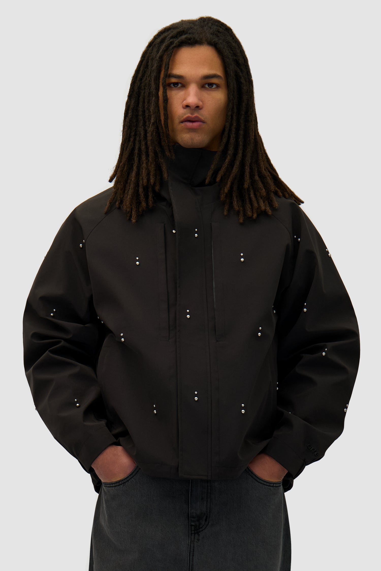Technical Revits Jacket in Black worn by a model, half-body front view