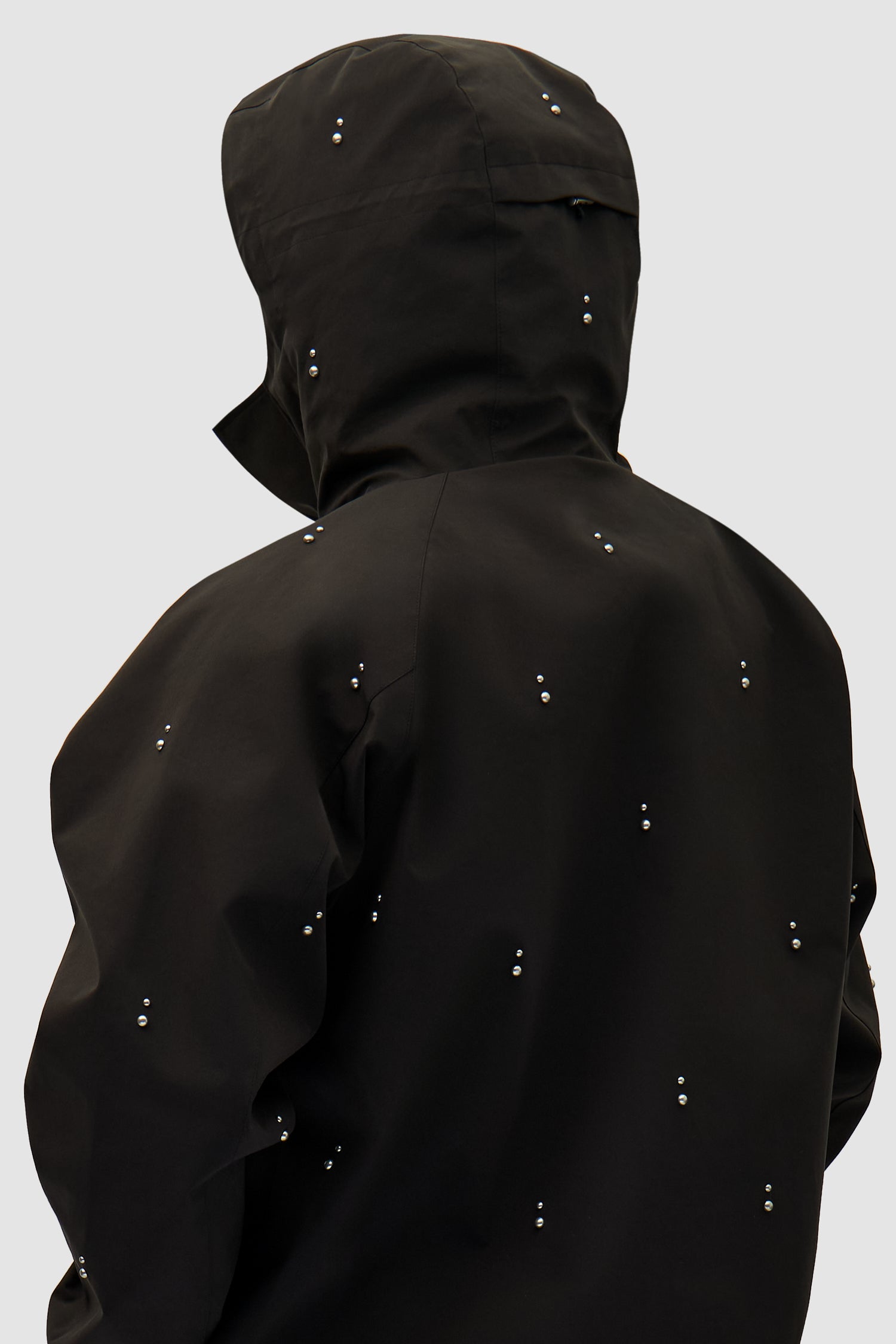 Technical Revits Jacket in Black worn by a model, half-body detailed view