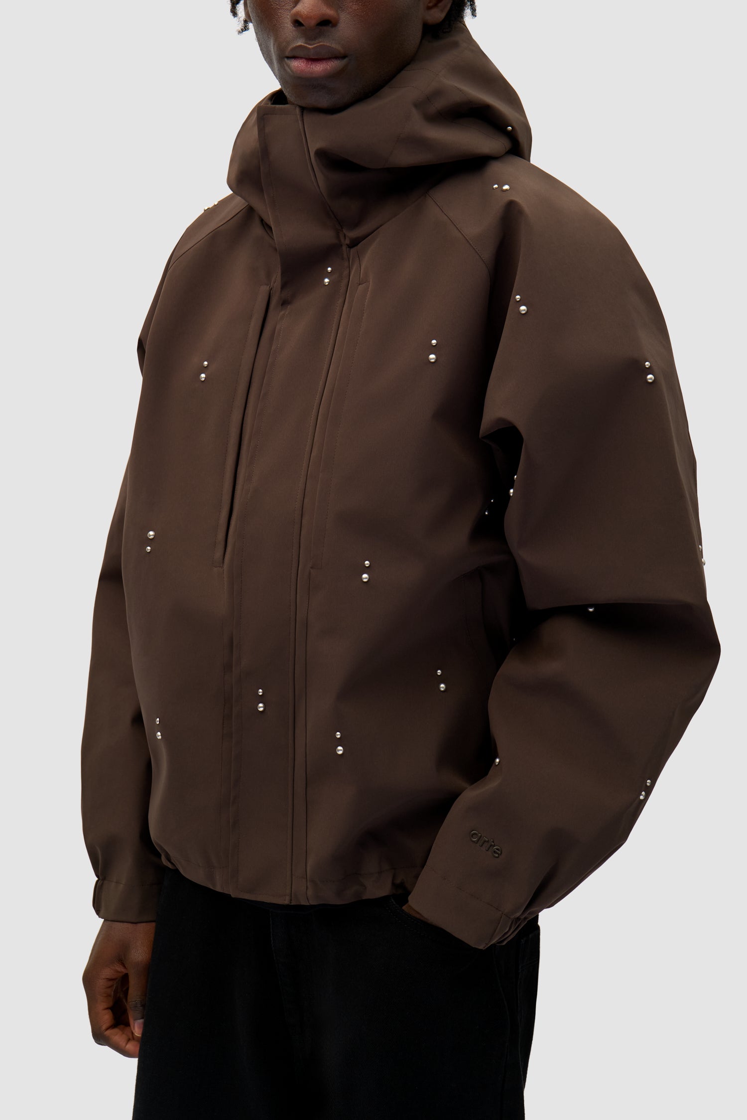 Technical Revits Jacket in Brown worn by a model, half-body detailed view