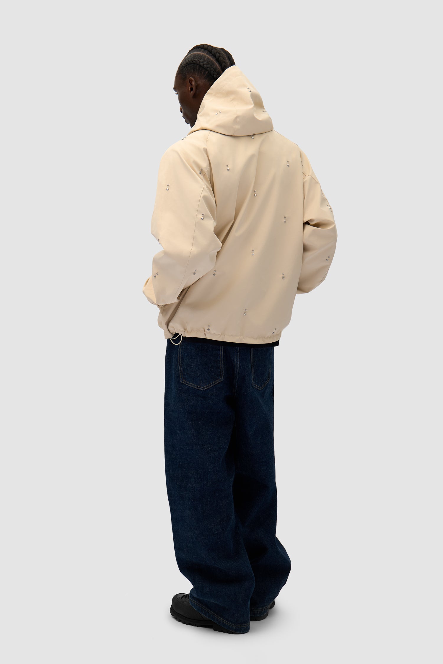 Technical Revits Jacket in Cream worn by a model, full-body back view