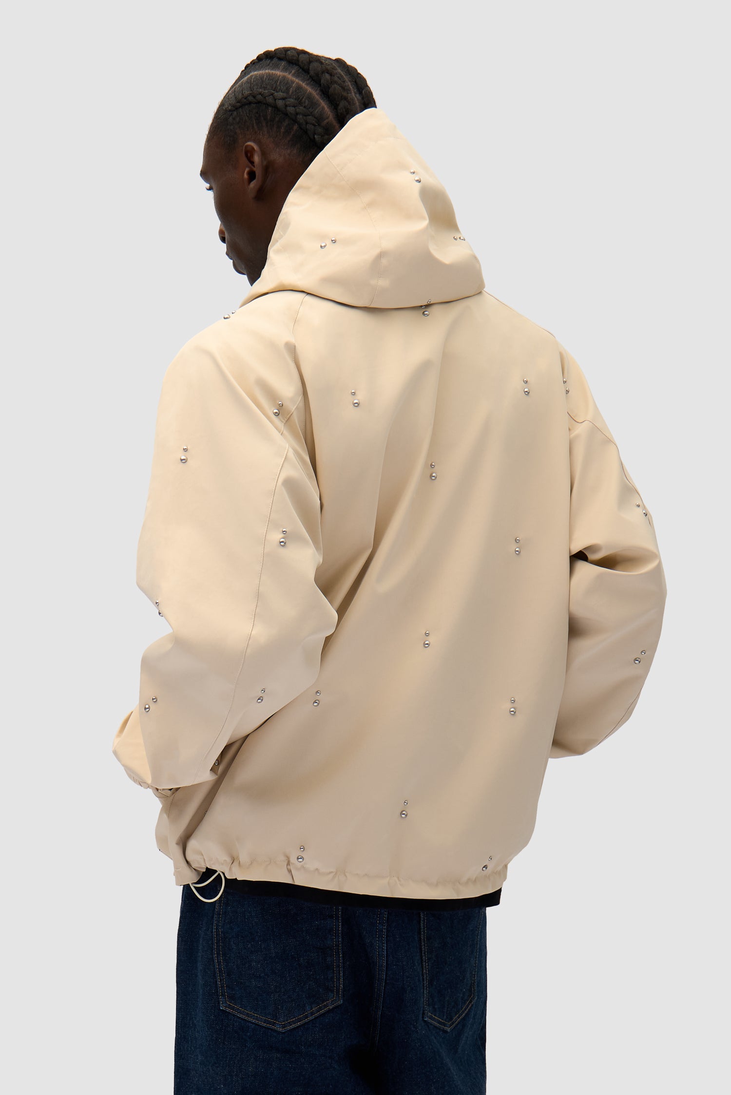 Technical Revits Jacket in Cream worn by a model, half-body back view