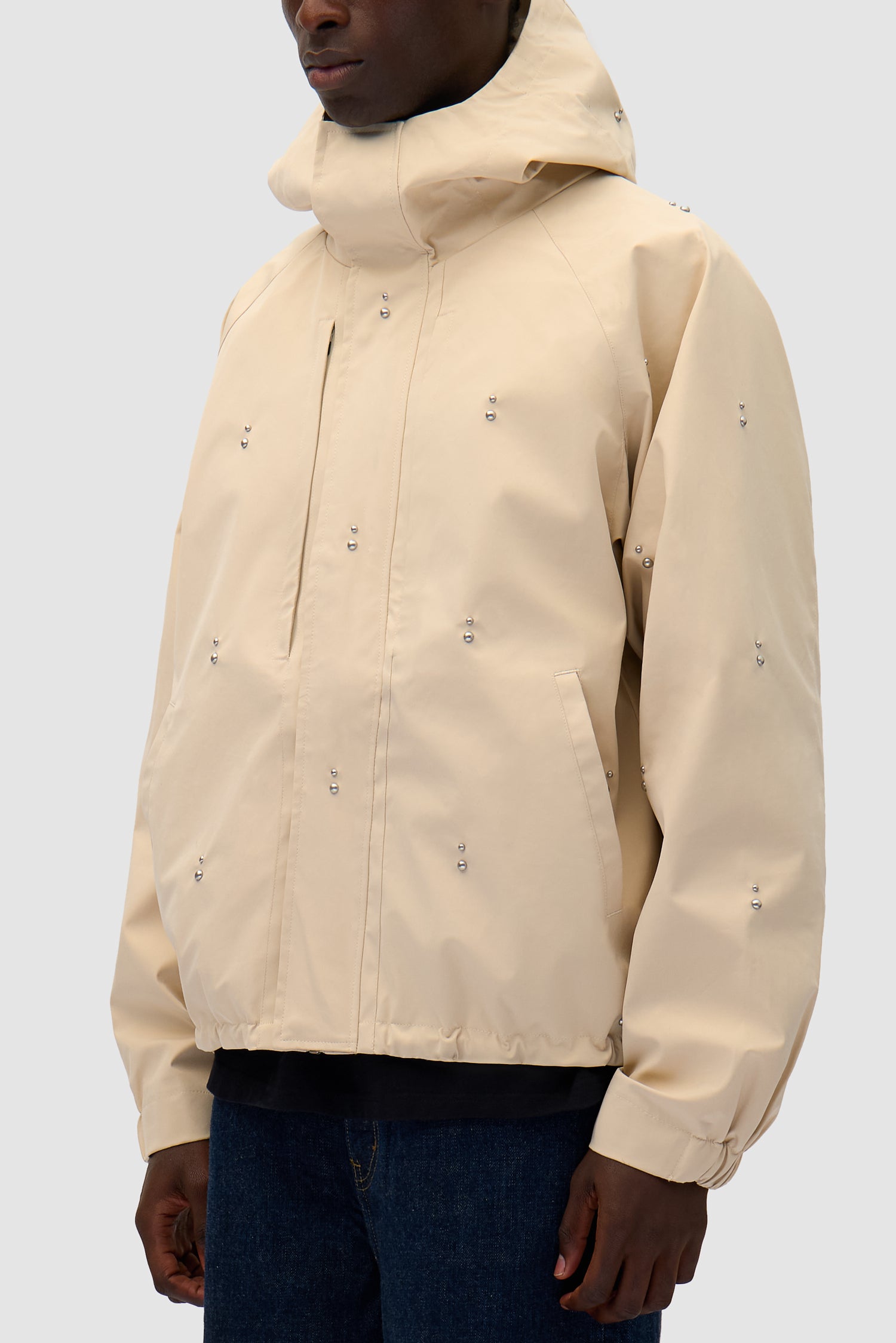 Technical Revits Jacket in Cream worn by a model, half-body detailed view
