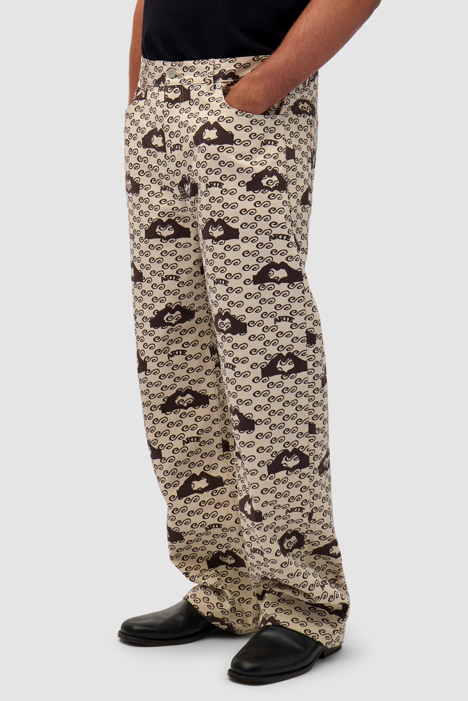 Hand Heart Print Pants in Cream/Brown worn by a model, half-body back view