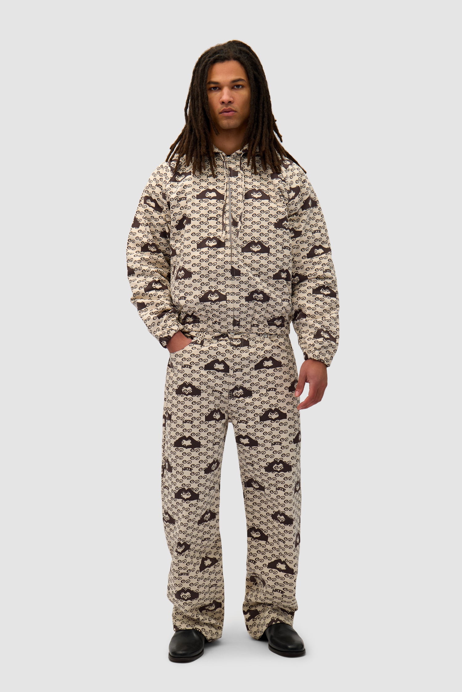 Hand Heart Print Pants in Cream/Brown worn by a model, full-body front view