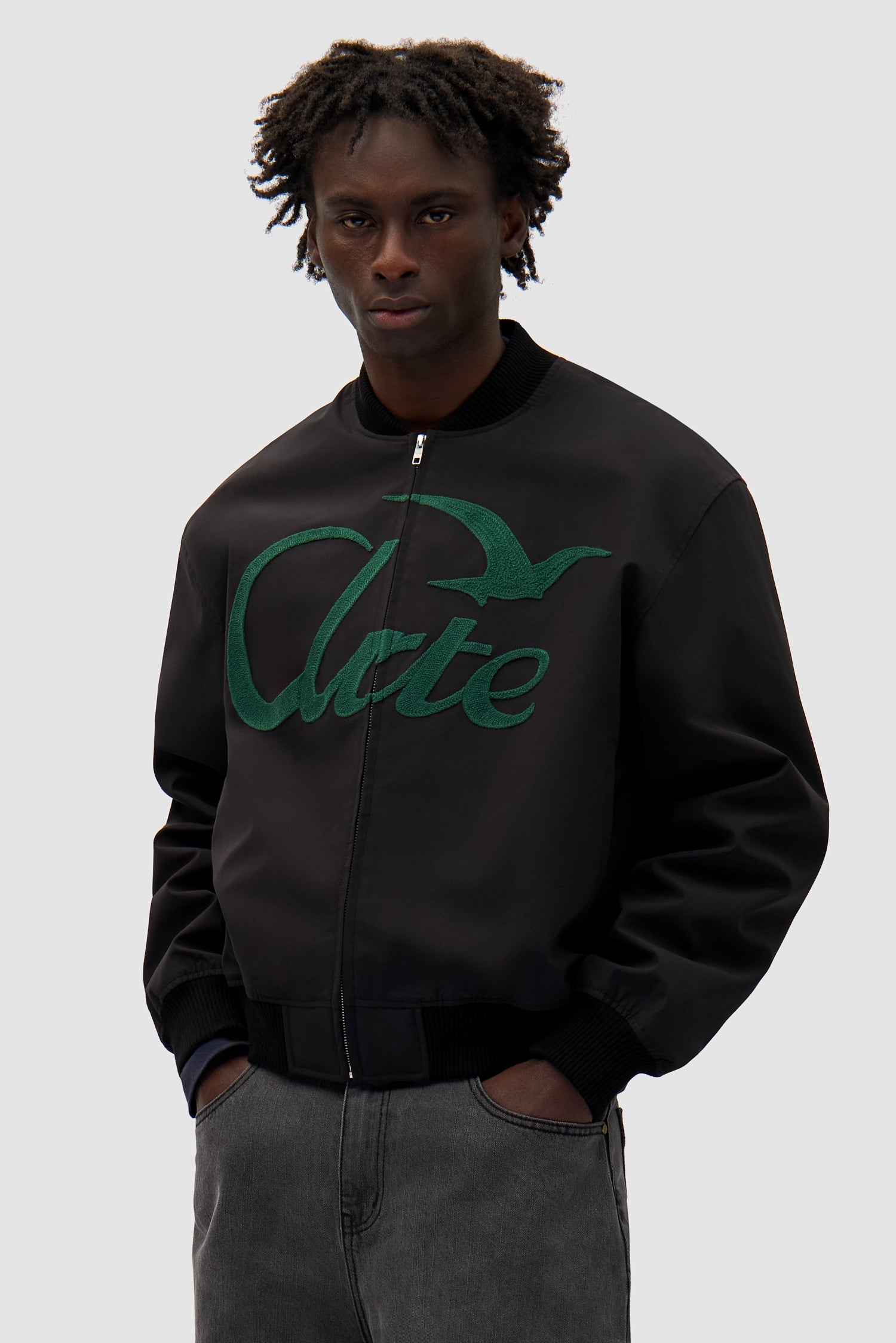 Logo Bird Bomber Jacket in Black worn by a model, half-body front view