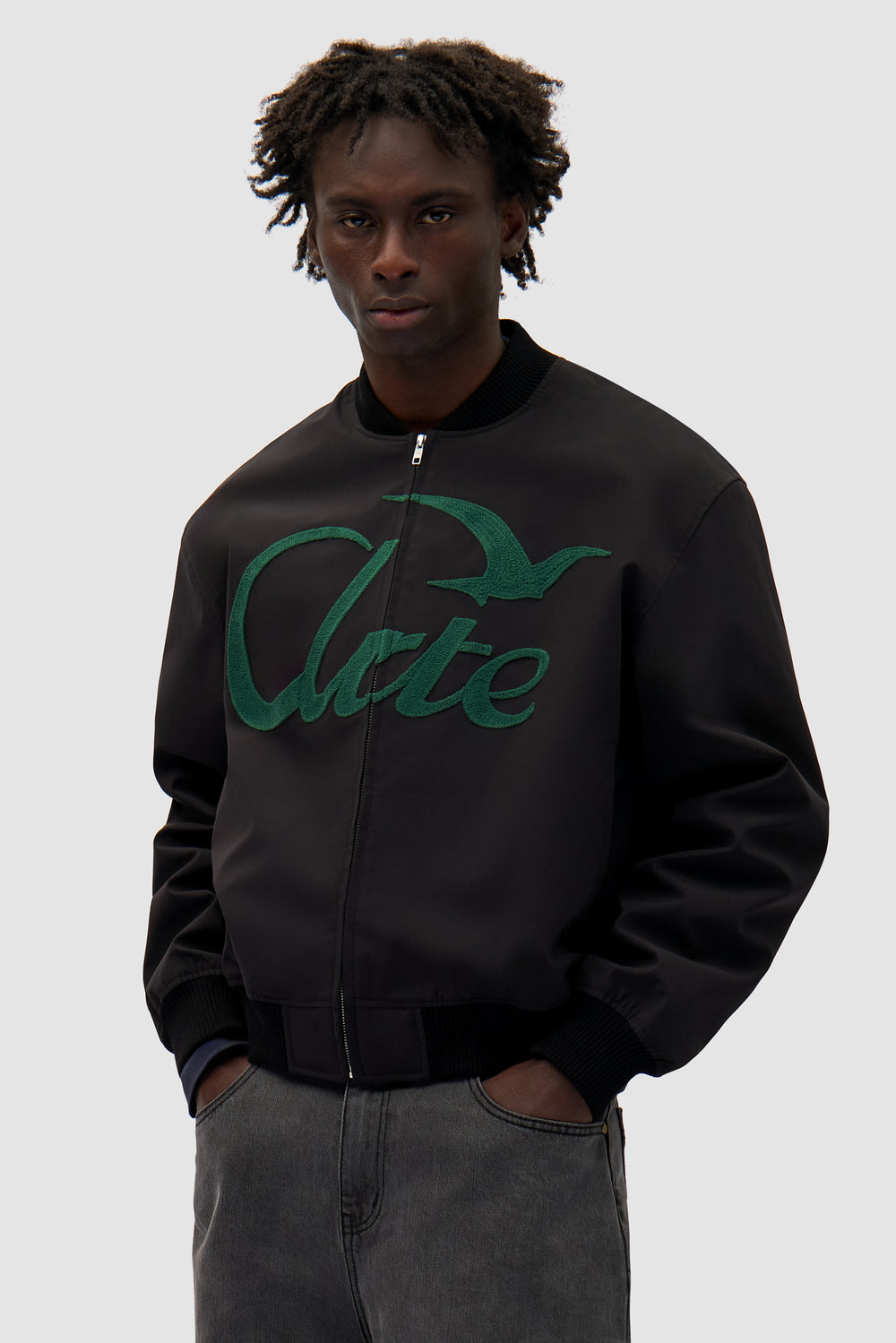 Logo Bird Bomber Jacket in Black worn by a model, half-body front view