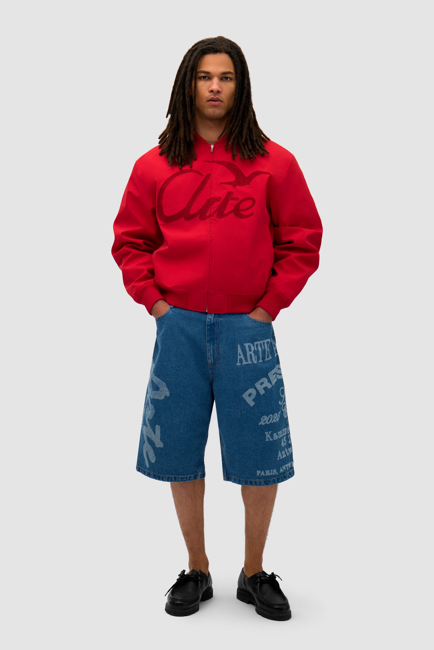 Logo Bird Bomber Jacket in Red worn by a model, full-body front view