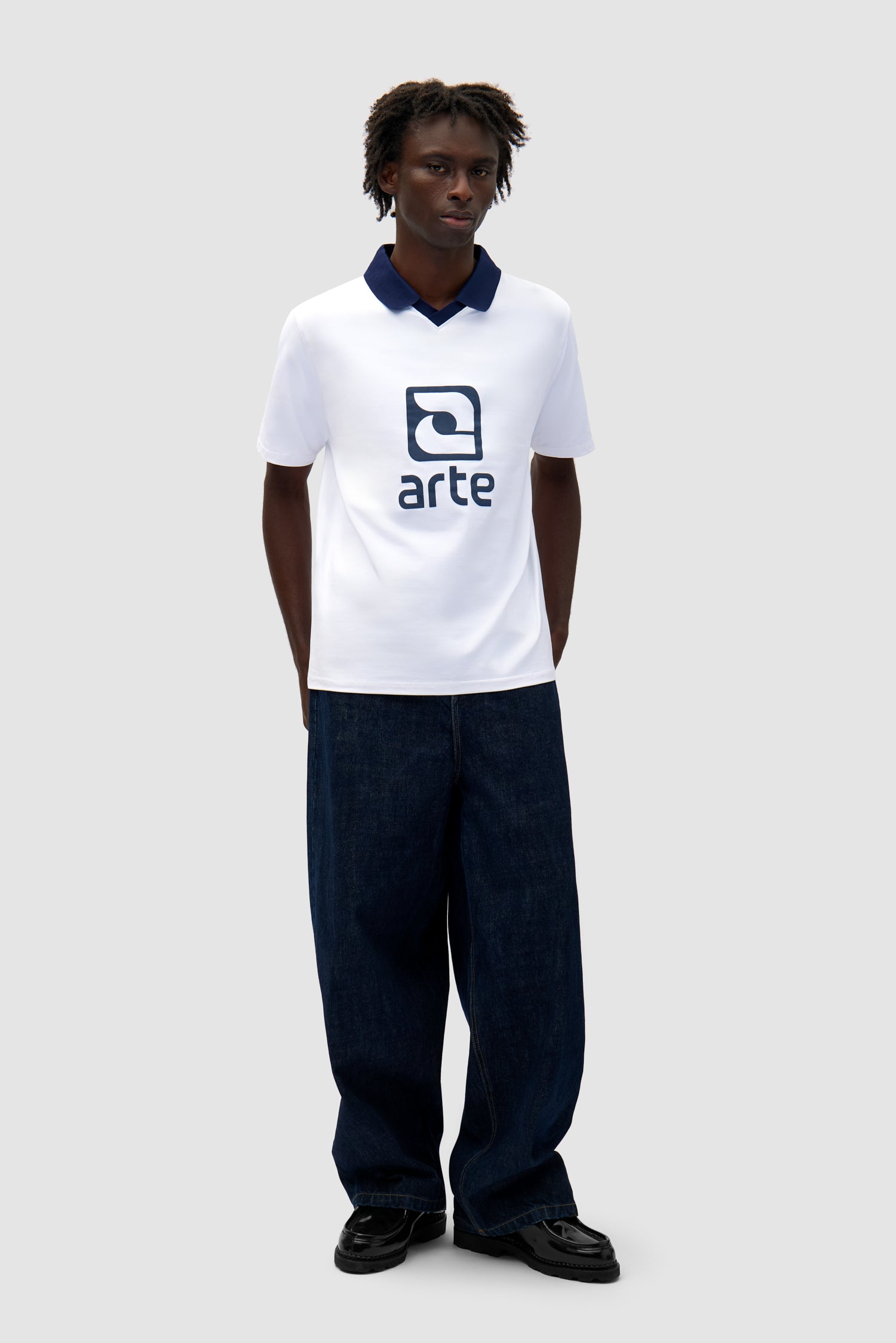 Logo Collar T-shirt in White/Navy worn by a model, full-body front view